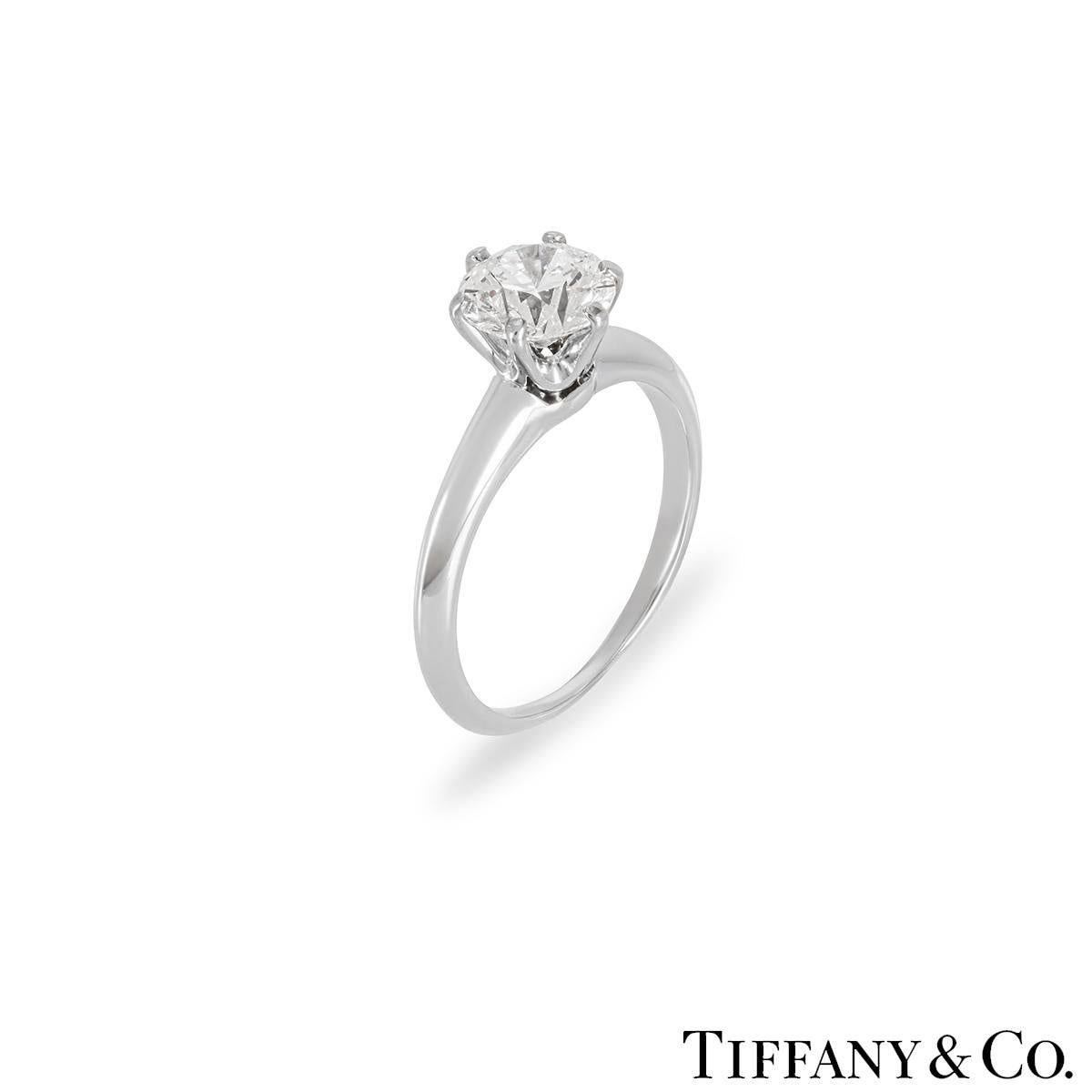 A stunning platinum diamond solitaire ring by Tiffany & Co. from the Setting collection. The solitaire features a round brilliant cut diamond set to the centre in a 6 prong mount weighing 1.18ct, D colour and VS1 clarity. The diamond scores an