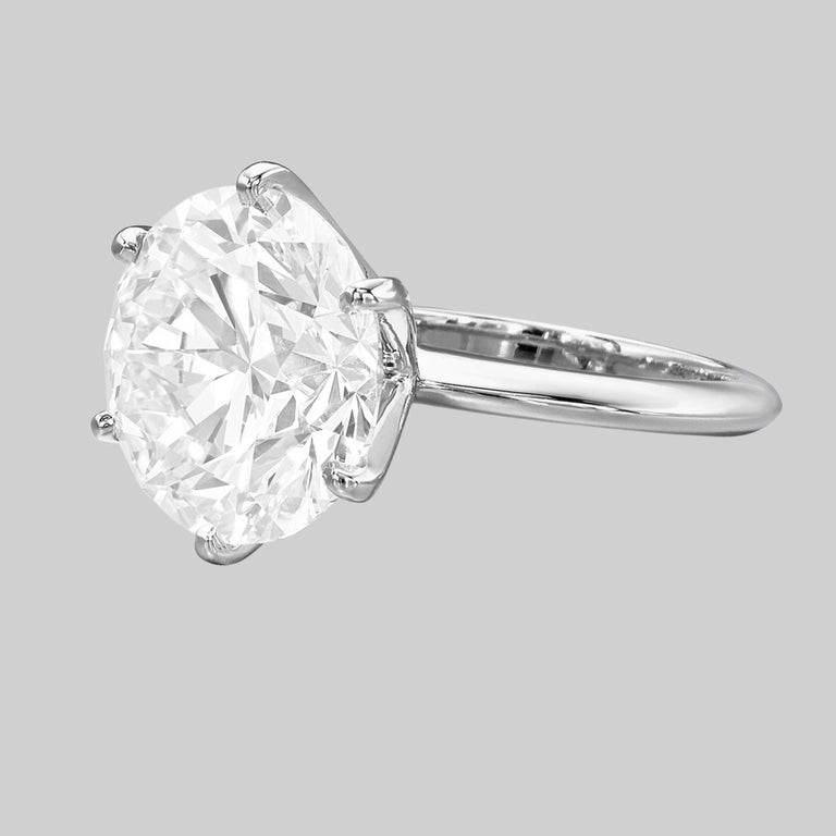 Tiffany & Co.  Platinum Round Brilliant Cut Diamond Solitaire Engagement Ring. 
The main diamond is a Round Brilliant Cut diamond weighing 4.52 ct, F in color, VVS2 in clarity. The center stone has a Very Good Cut, Very Good Polish, VERY GOOD