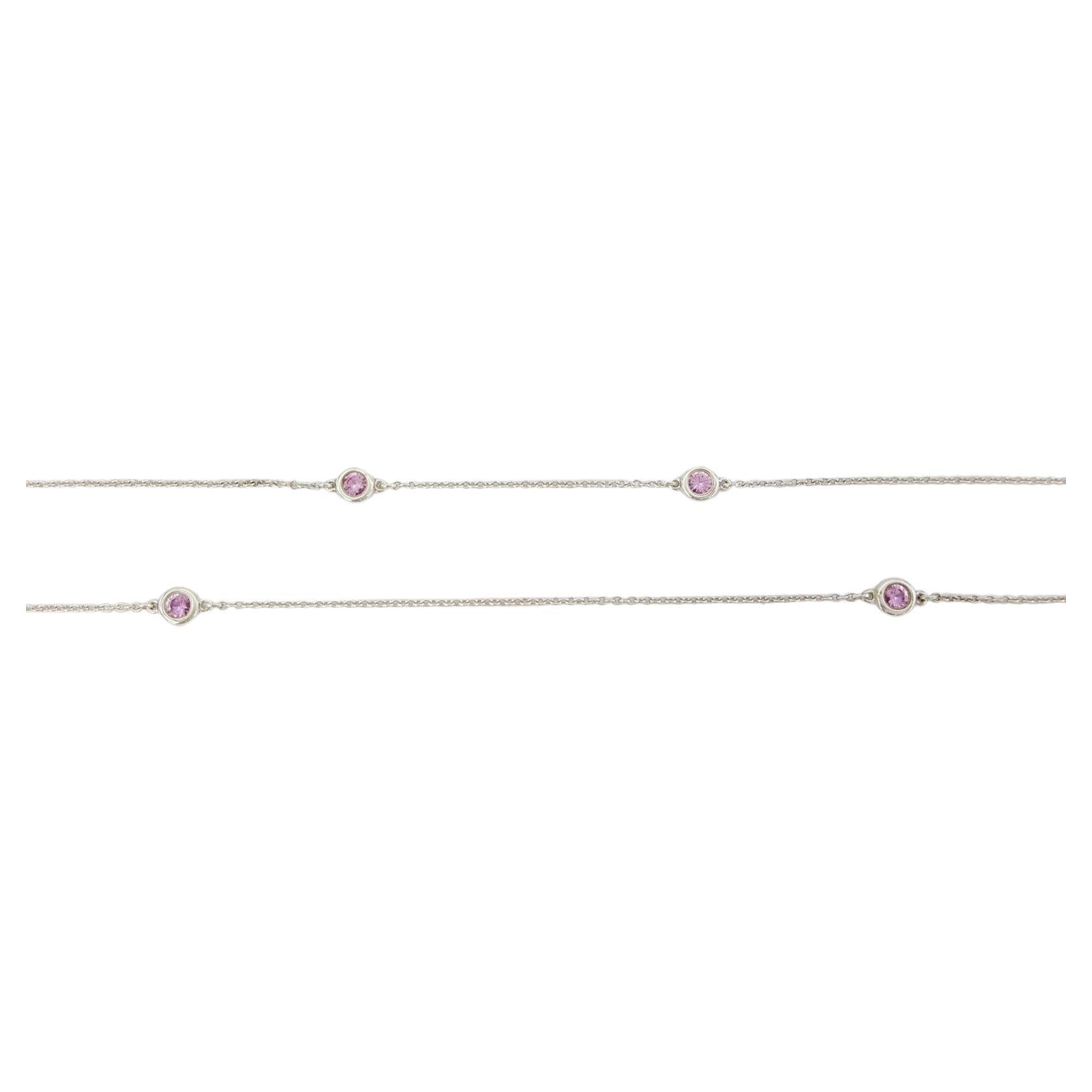 This is a 36-inch Tiffany & Co. Elsa Peretti® Color by the Yard® Sparkle necklace crafted from sterling silver, featuring a total weight of 1.3 carats of round brilliant-cut pink sapphires. The necklace, weighing 5.5 grams, comes with a 36-inch