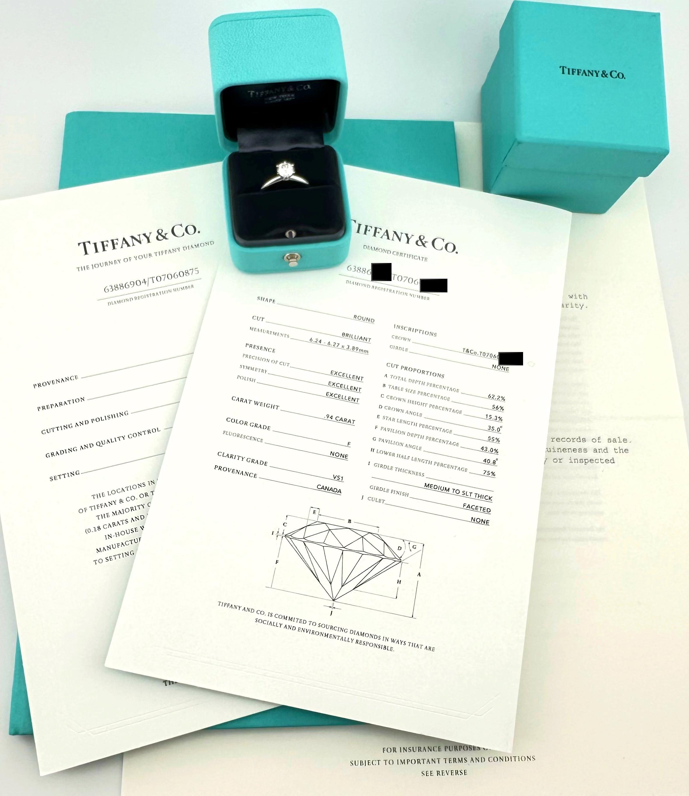 Tiffany & Co Solitaire Diamond Engagement Ring
Style:  Classic Tiffany Setting Prong Set Solitaire
Metal:  Platinum PT950
Size:  6.25 sizable
Main Diamond:  Round Brilliant Diamond 0.94 cts 
Color & Clarity:  F, VS1
Diamond Inscription:  T&Co.