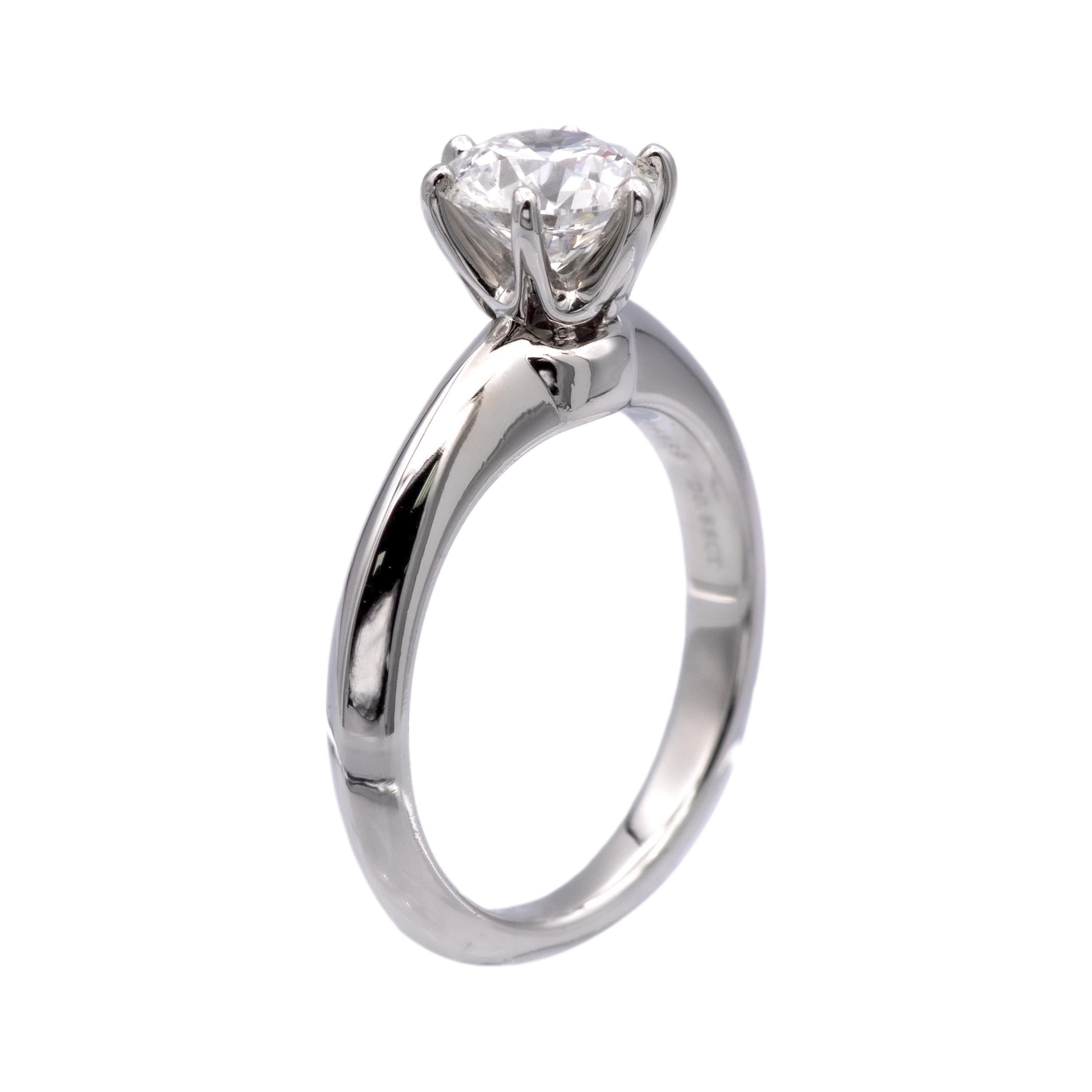 Tiffany & Co. solitaire engagement ring finely crafted in a 6 prong platinum mounting featuring a round brilliant cut center weighing 0.88 carats, G color VVS2 clarity diamond with excellent cut , polish and symmetry. Fully hallmarked with logo,