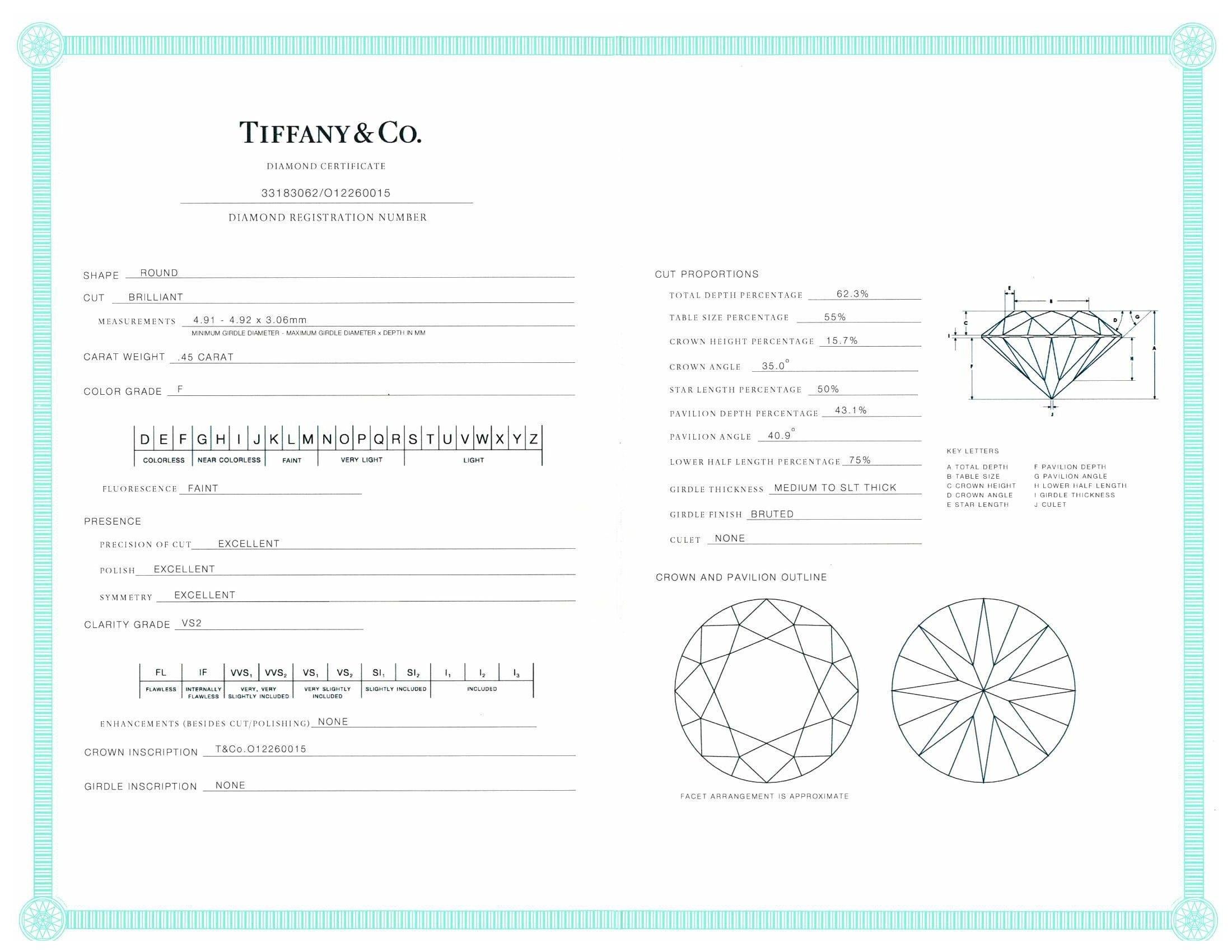 Tiffany & Co. Platinum Round Diamond Engagement Ring Diamond band .73cts tw FVS2 In Excellent Condition In New York, NY