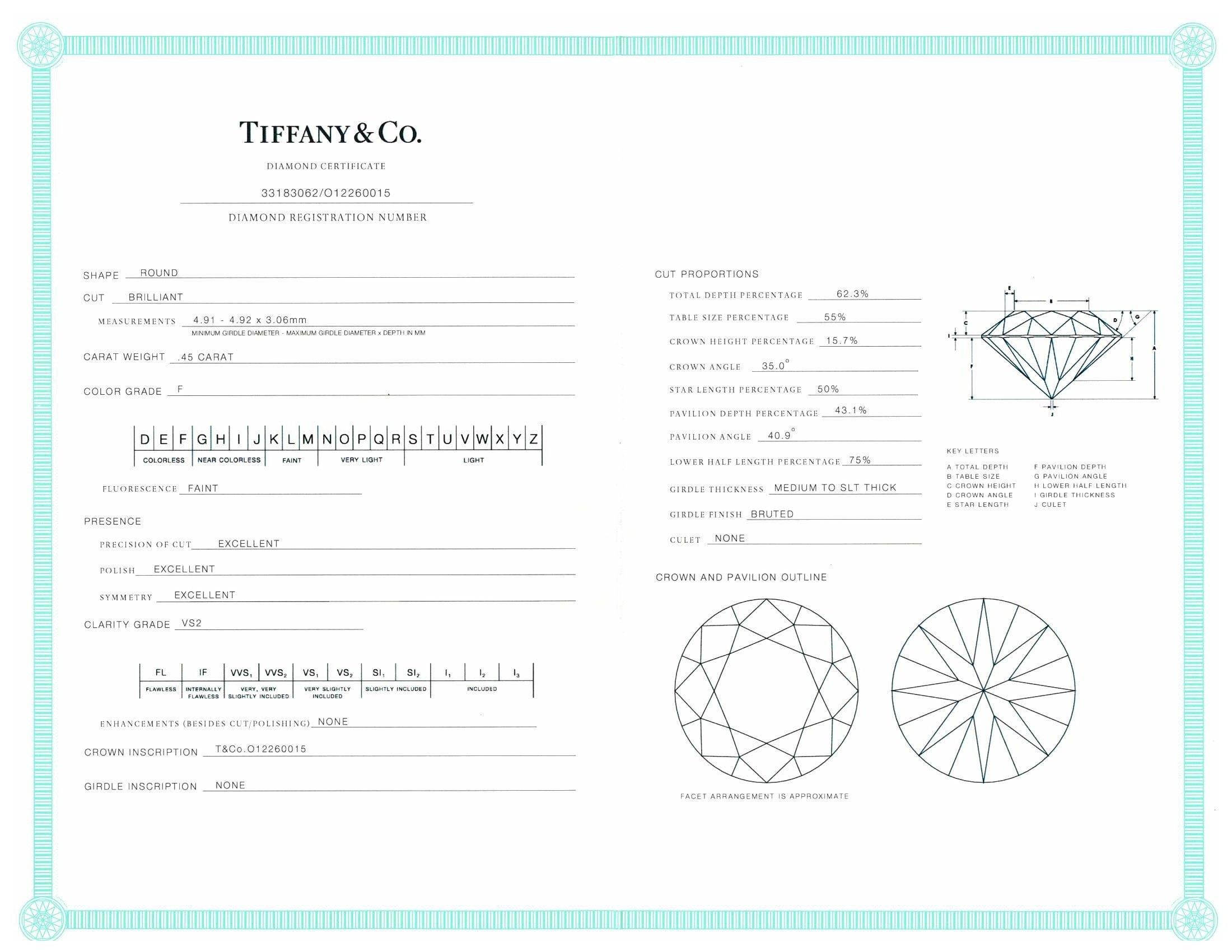 Tiffany & Co. Platinum Round Diamond Engagement Ring Diamond band .73cts tw FVS2 In Excellent Condition For Sale In New York, NY