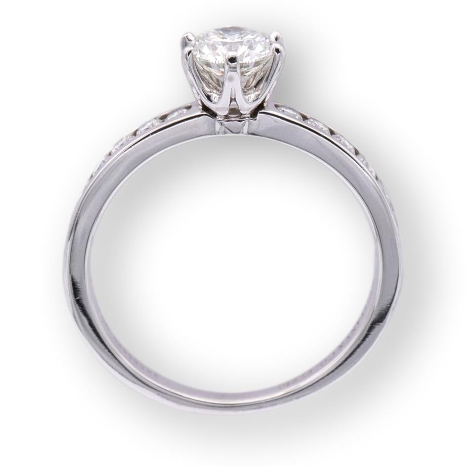 Modern Tiffany & Co. Platinum Round Diamond Engagement Ring with Diamond Band .70 cts.
