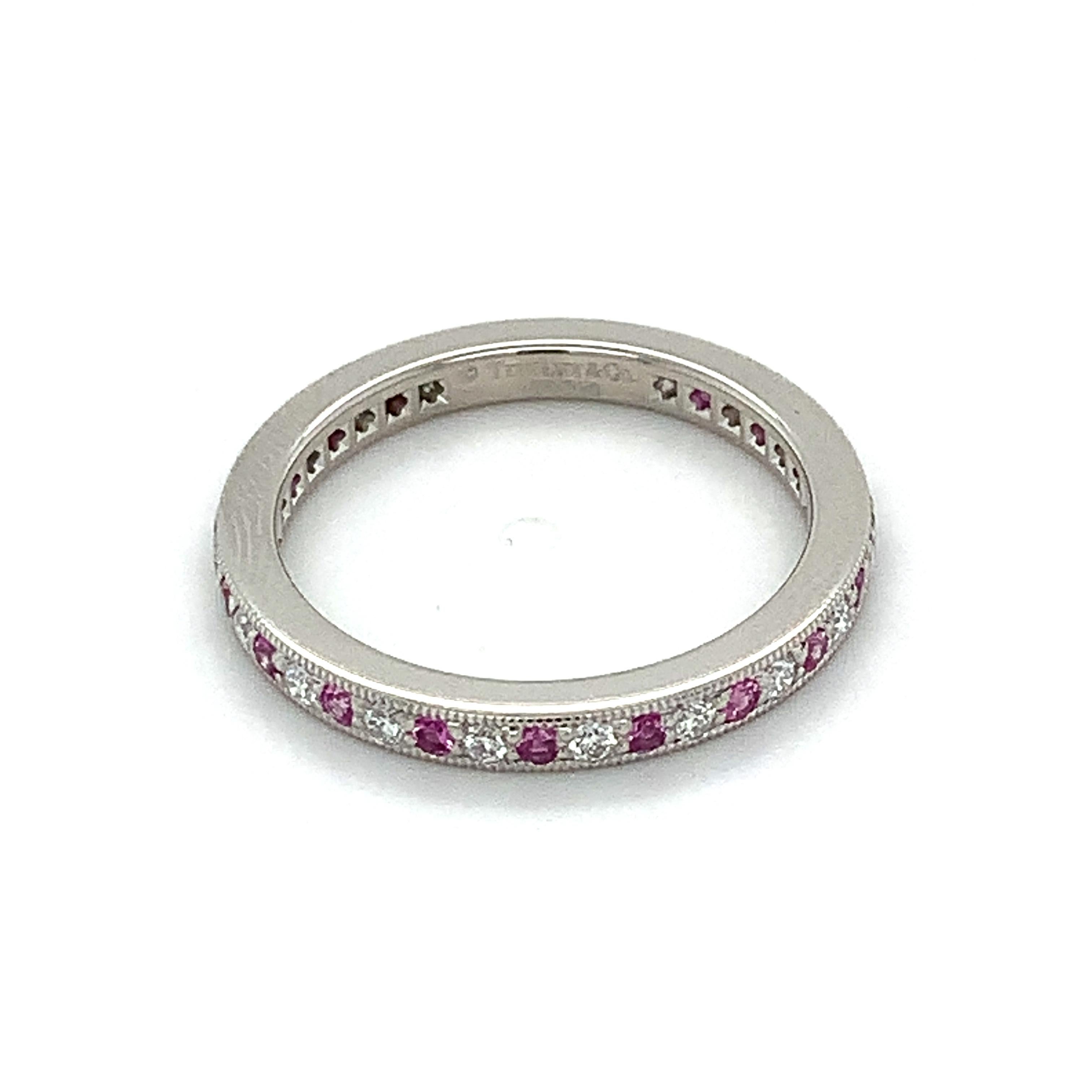 Tiffany & Co Platinum Round Diamond & Pink Sapphire Band
Ring Size 6.25
4.1 Grams
White Round Brilliant Cut Diamonds 0.19 Carats Total Weight
Color: F
Clarity: VS2
Pink Round Sapphires 0.24 Carats Total Weight

This is a beautiful Tiffany & Co.