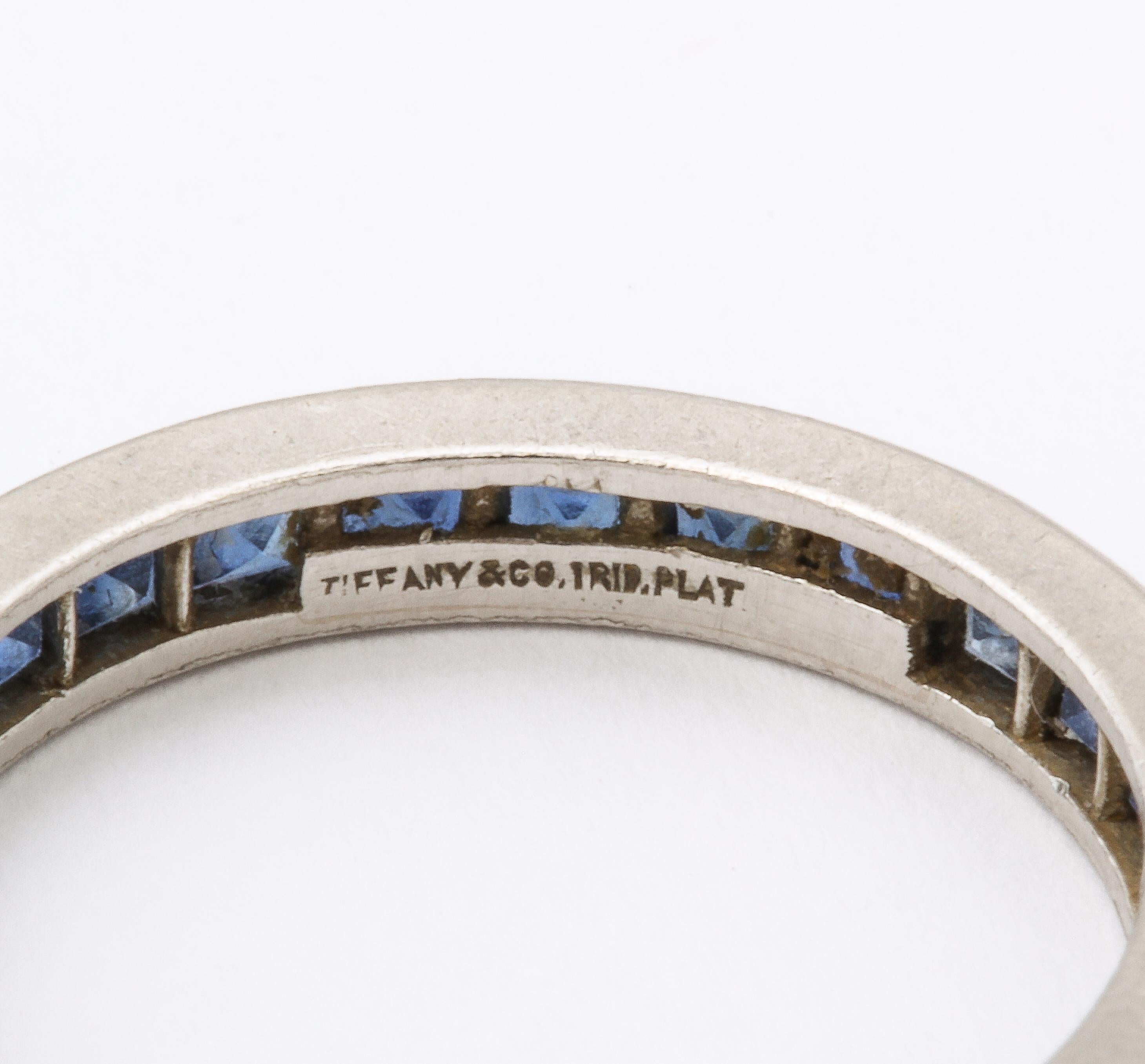 Platinum eternity wedding band ring by Tiffany & Co. Full circle of blue sapphires, marked Tiffany & Co. 

Ring Size 6
3.1mm wide, 20.5mm diameter