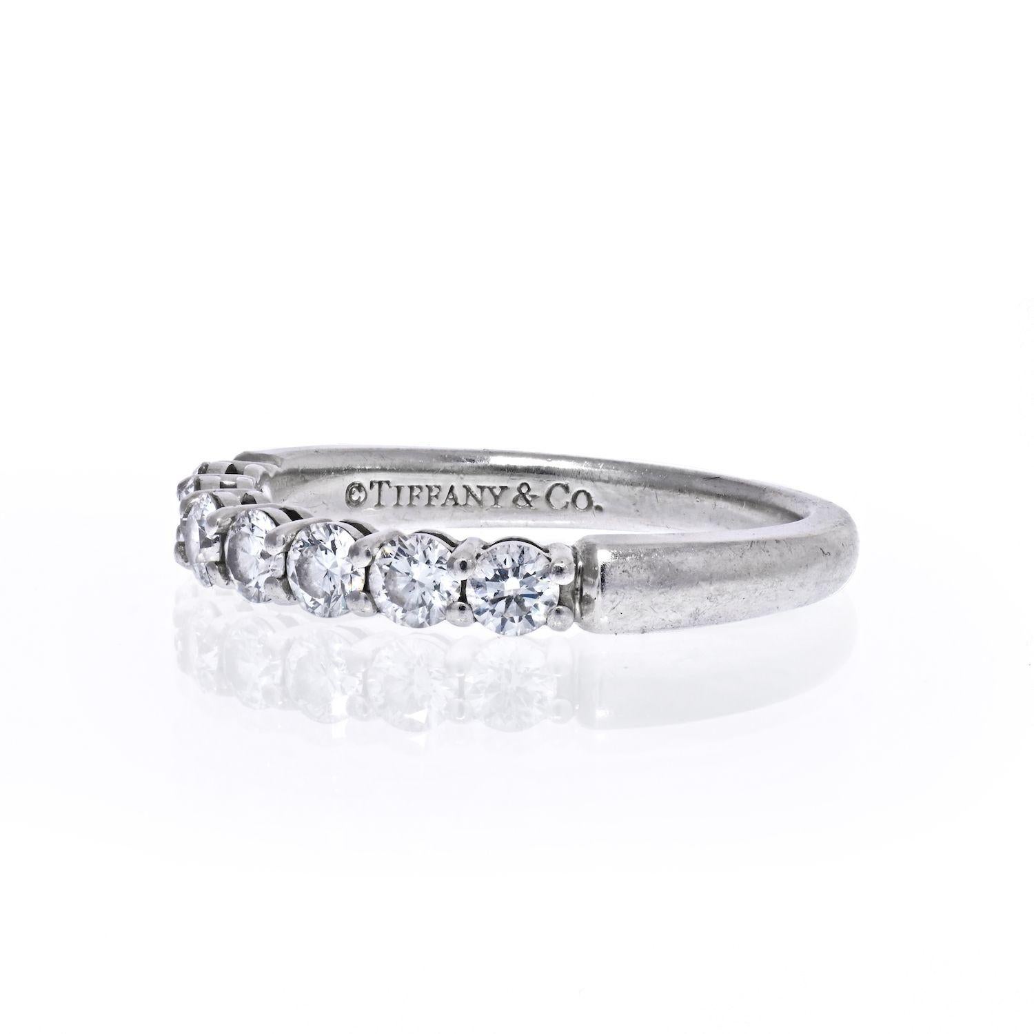 Tiffany & Co shared prong seven diamond wedding band crafted in patinum. Size 6. 
Approx. carat weight 0.45cttw. 
