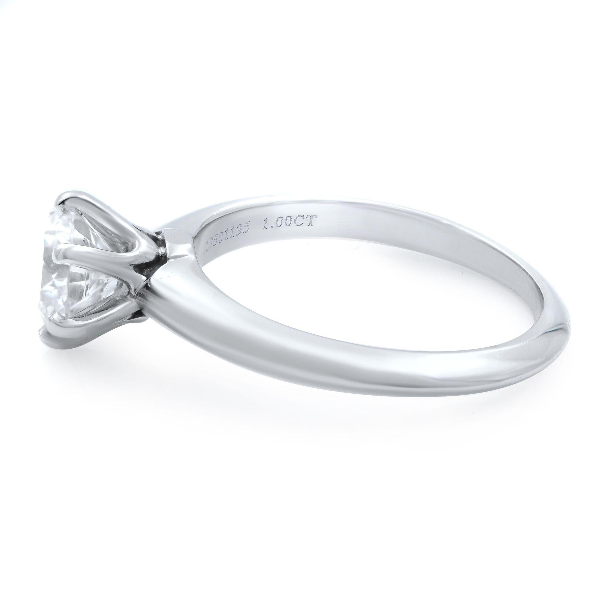 Tiffany platinum six prong one round cut brilliant diamond engagement ring. Weighing 1.00cts, F color, VS1 clarity. Finger size 5.5. Excellent pre-owned condition. Comes with original box, GIA report, Tiffany & Co. diamond certificate and a copy of