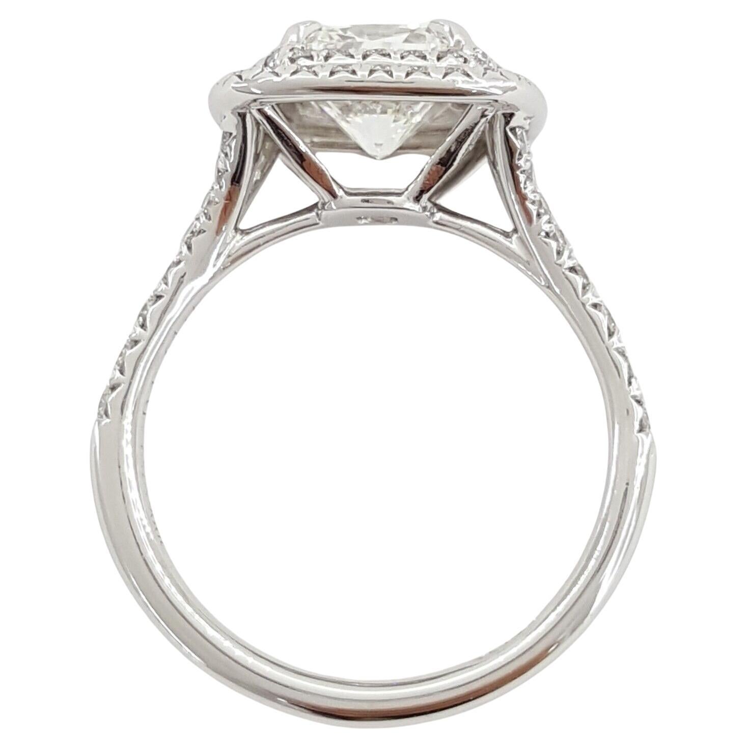 Tiffany & Co. Platinum Soleste® 2.02 ctw Cushion Excellent Cut Diamond Double Halo Engagement Ring.
The ring weighs 5.1 grams, size 5.25, the center stone is a 1.64 ct Natural Cushion Brilliant Cut Diamond, I in color, VS1 in clarity, Excellent Cut,