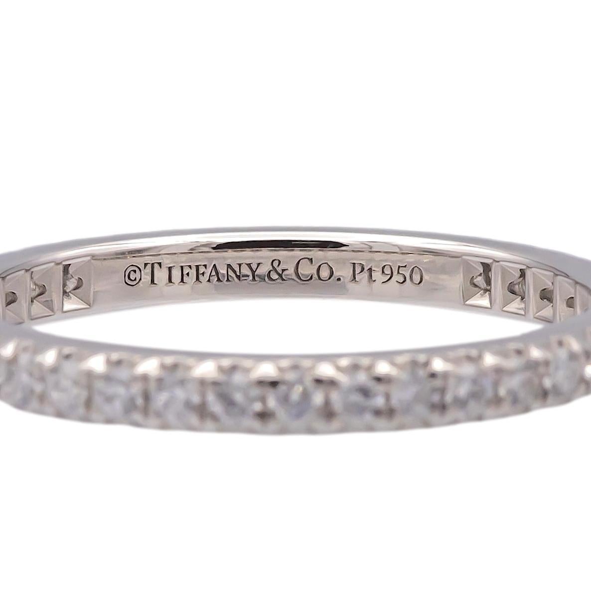 This Tiffany & Co. Soleste full circle diamond band is crafted in platinum and set with approximately 0.34 carats of round brilliant diamonds. The diamonds, graded F color and VVS clarity, are meticulously set in a continuous design, creating an