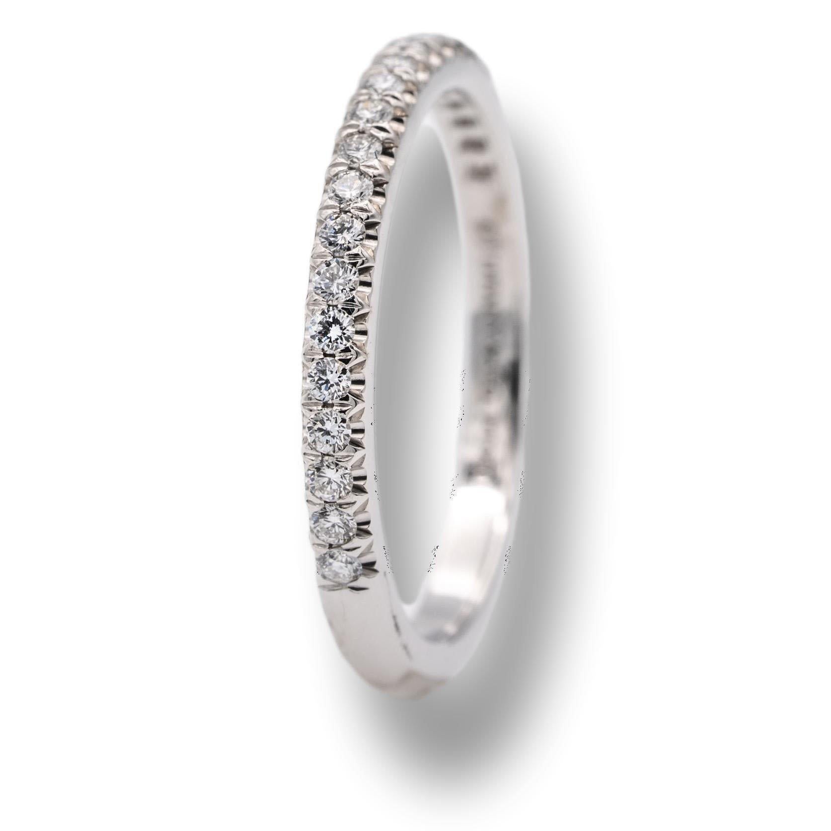 Tiffany & Co. Soleste Wedding/Anniversary Half-Band finely crafted in Platinum with 22 round brilliant cut diamonds weighing 0.17 carats total weight encrusted in 