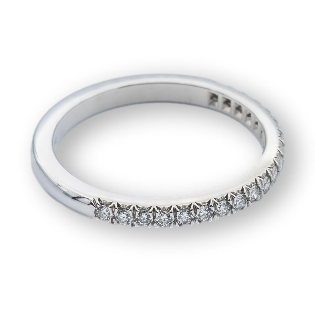 Tiffany & Co. Soleste Wedding/Anniversary Half-Band finely crafted in Platinum with 20 round brilliant cut diamonds weighing 0.17 carats total weight encrusted in 