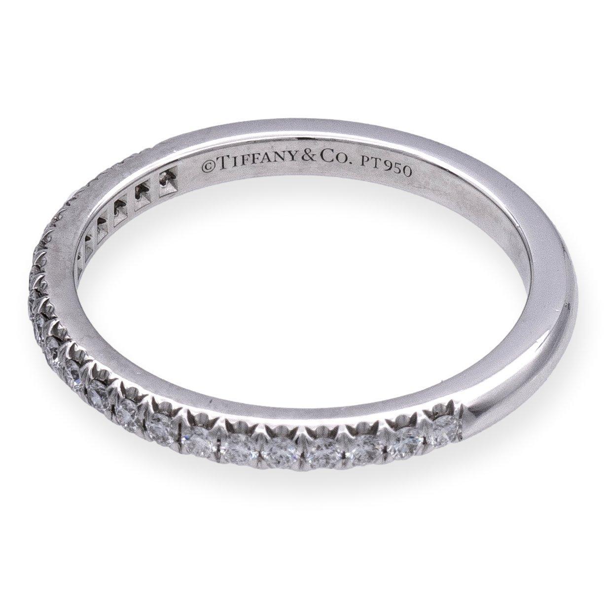 Tiffany & Co. Soleste Wedding/Anniversary Half-Band. Impeccably crafted in platinum, this radiant piece features 21 round brilliant cut diamonds, totaling 0.17 carats. Each diamond is meticulously set in a captivating 