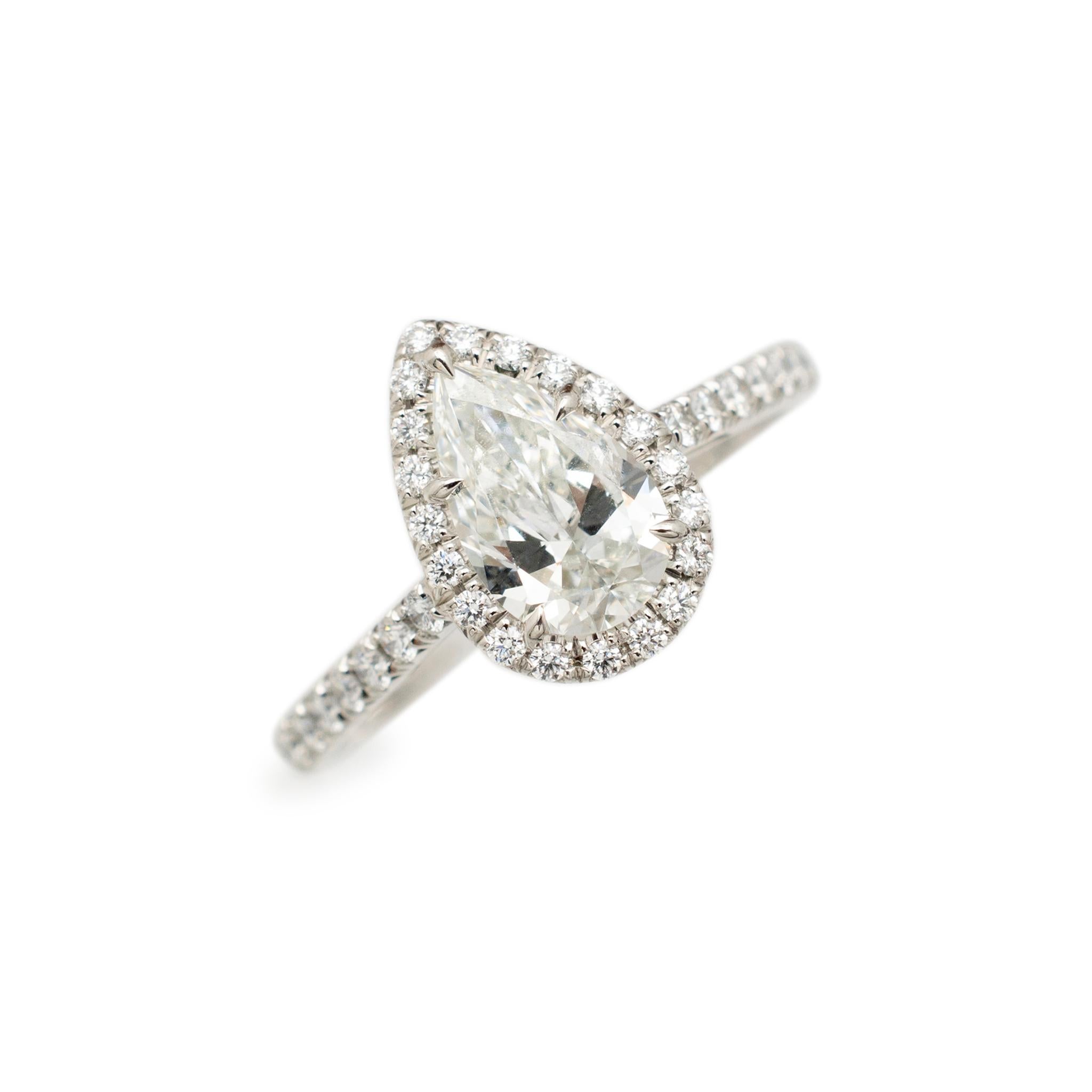 Brand: Tiffany & Co.

Gender: Ladies

Metal Type: Platinum

Size: 5

Shank Maximum Width: 1.50 mm

Head measurement: 10.80mm x 7.70mm

Weight: 2.40 grams

Ladies 950 platinum diamond engagement halo ring with a half round shank. Engraved with
