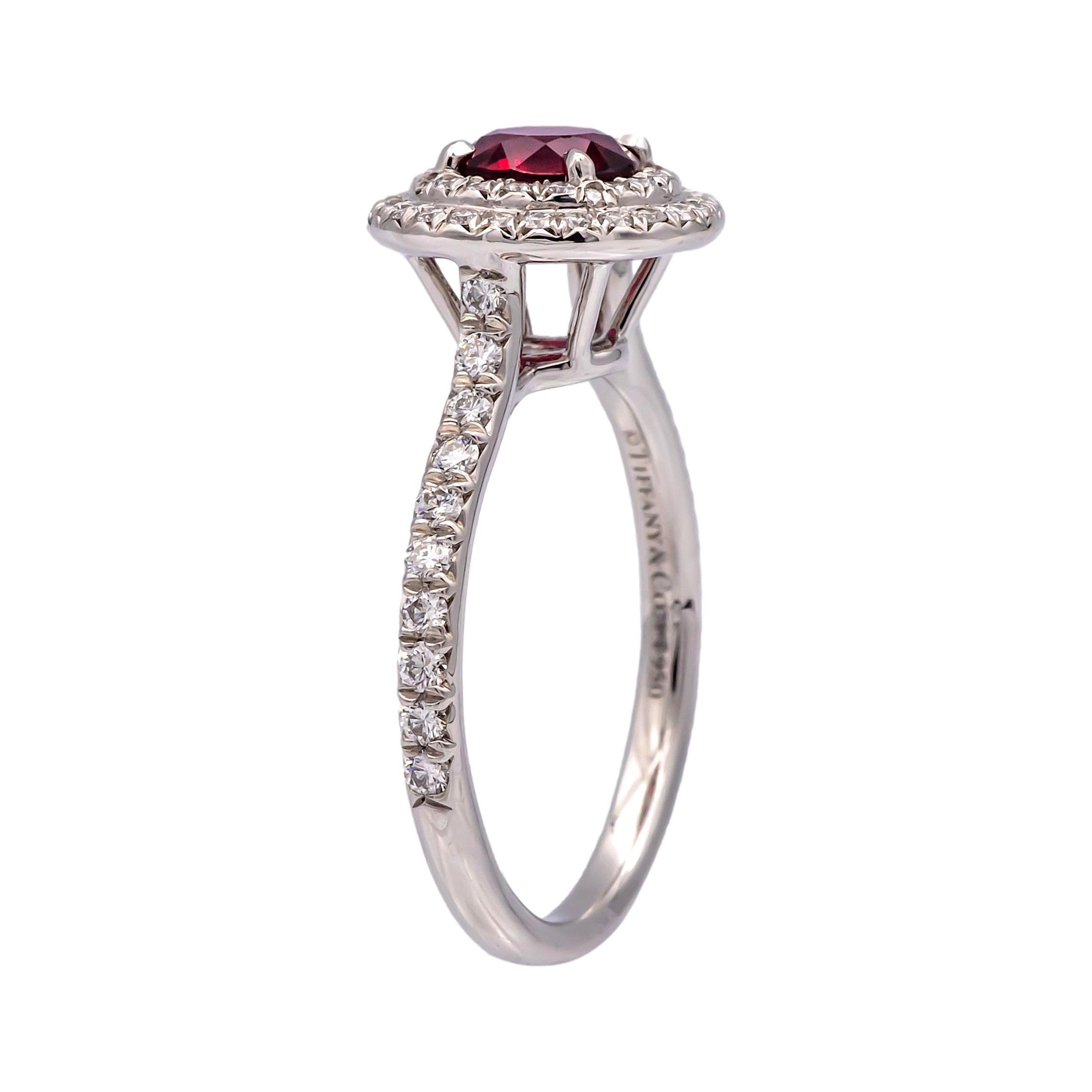 This Tiffany & Co. Double Soleste Ring, crafted in platinum (PT950), features a 0.50-carat round ruby at its center, surrounded by two rows of round brilliant diamonds for a timeless and elegant look. The side diamonds total 0.36 carats, with