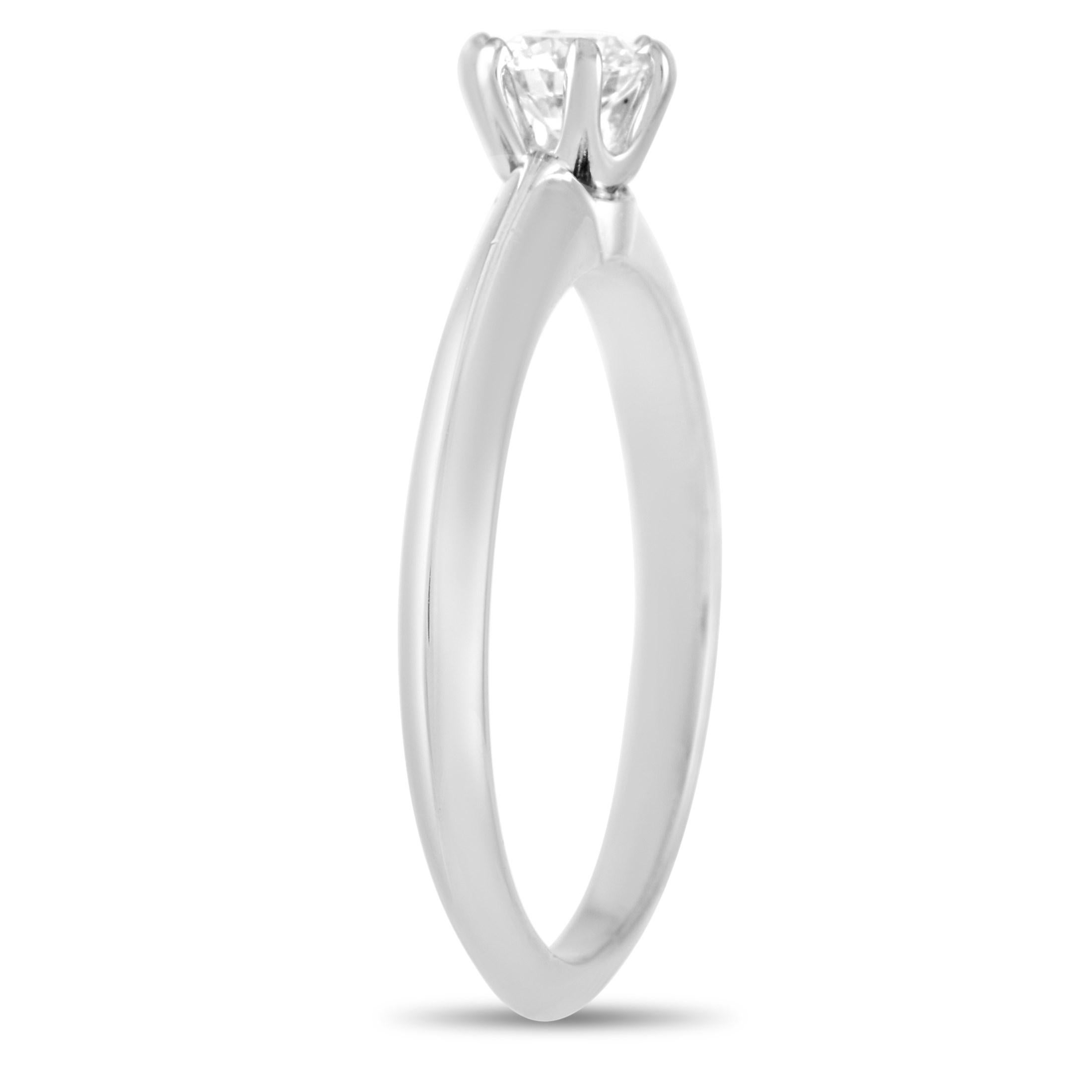 This classic Tiffany & Co. Platinum Solitaire 0.37 ct Diamond Engagement Ring is a timeless piece. The simple band is made with platinum and highlights a single 0.37 carat round-cut diamond of G color and VS2 clarity. The ring weighs a total of 4.0