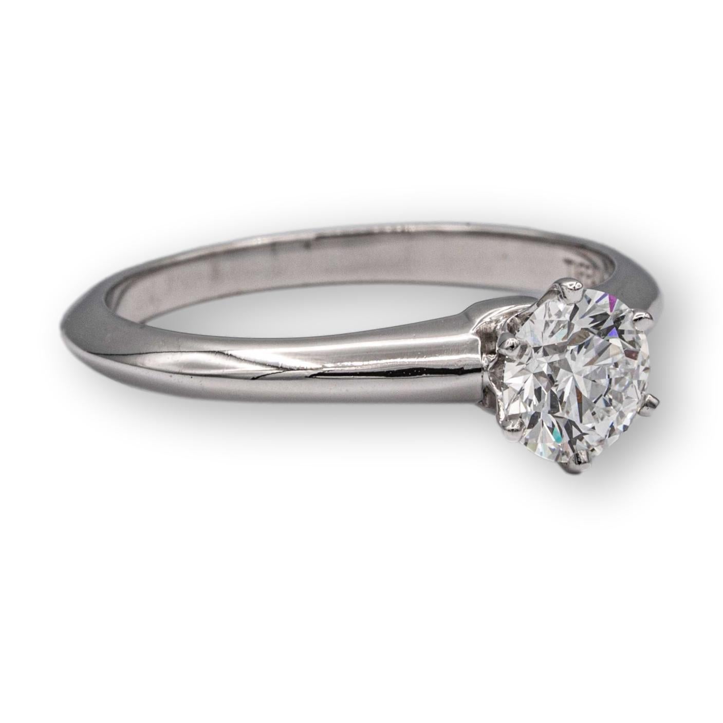 Tiffany & Co. Vintage solitaire engagement ring with a round brilliant cut diamond center weighing 0.61 carats G color fine VVS2 clarity. Accompanied by Tiffany Appraisal. Ring is Fully Hallmarked.

RING SPECIFICATIONS:
Brand: Tiffany &