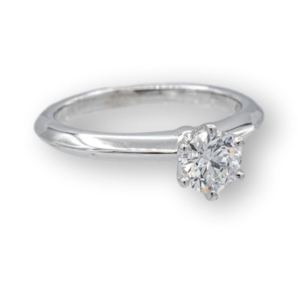 Tiffany & Co Round Brilliant Solitaire featuring a 0.54 ct Center F color VS1 clarity diamond finely crafted in a 6 prong Platinum Mounting. Fully hallmarked with logo, serial numbers and metal content.


Ring Specifications
Brand: Tiffany &