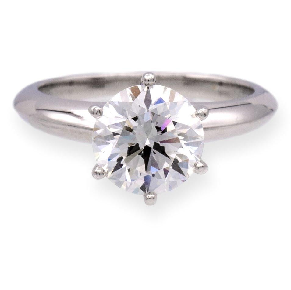 Tiffany & Co. solitaire engagement ring finely crafted in platinum featuring a fine 1.44 carat , G color and VS1 clarity round brilliant cut diamond set in six prongs. This ring has been inspected and appraised by the International Gemological