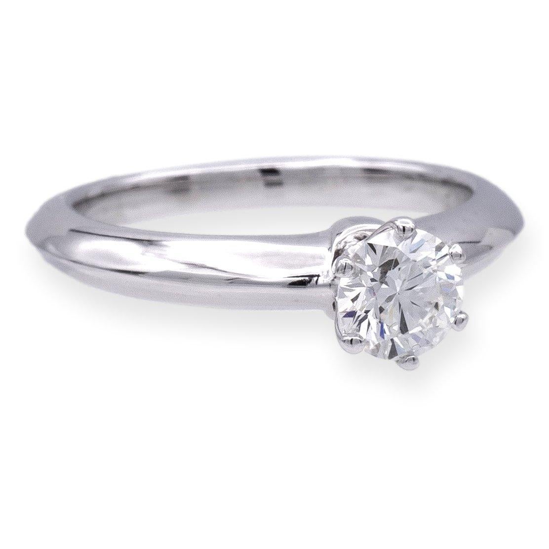 Tiffany & Co Round Brilliant Solitaire featuring a 0.54 ct Center I color VVS1 clarity diamond finely crafted in a 6 prong Platinum Mounting. Fully hallmarked with logo, serial numbers and metal content.

Ring Specifications
Brand: Tiffany &