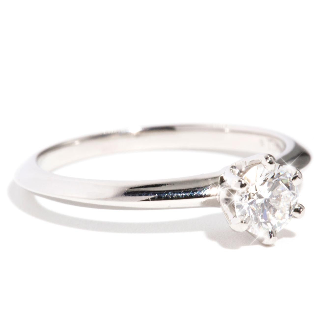 Crafted in Platinum is this genuine Tiffany & Co. 'The Tiffany Setting' solitaire Engagement Ring. The Tiffany & Co. engagement ring features a 0.40 carat round brilliant cut diamond set in the infamous 'Tiffany' setting.  This gorgeous ring is