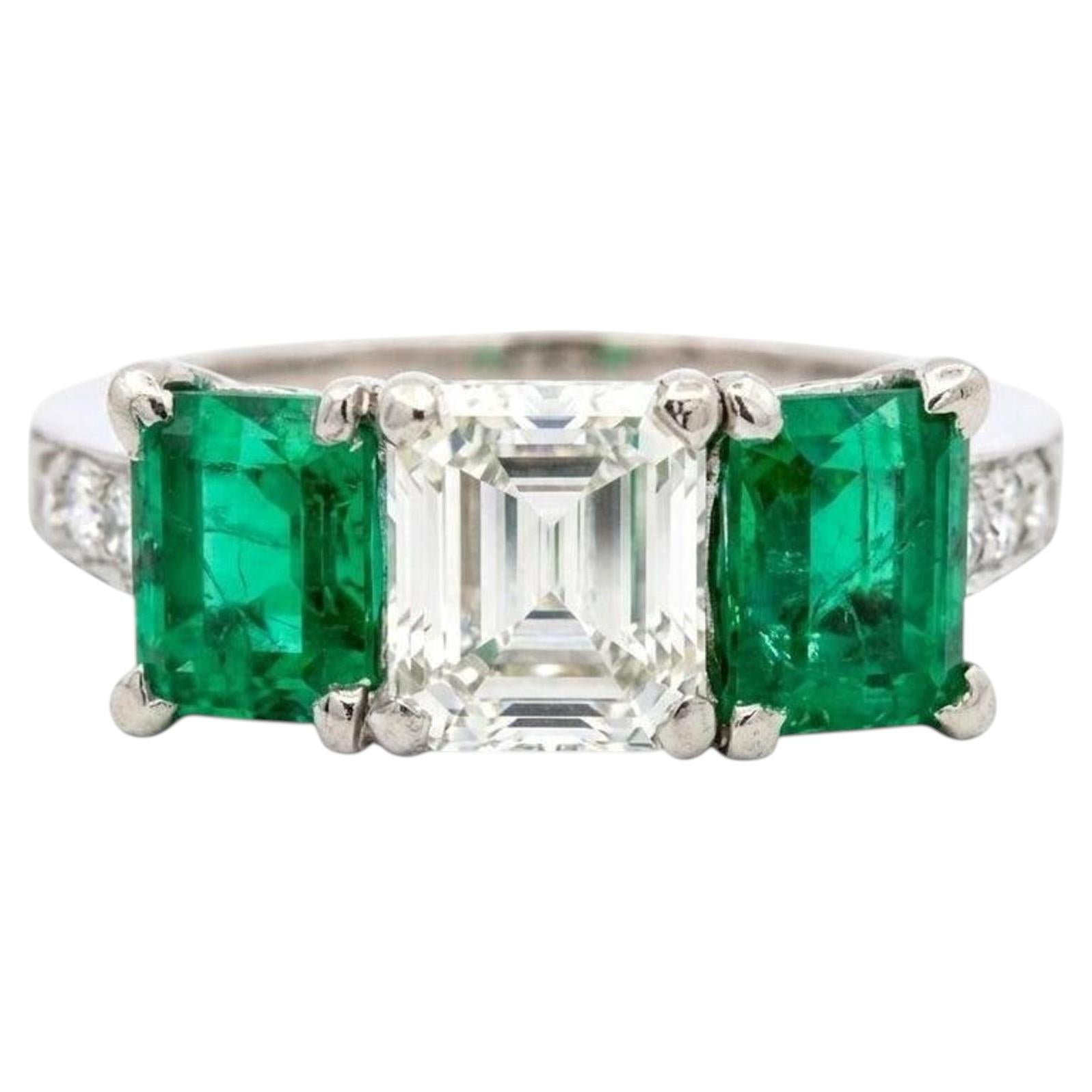 Tiffany & Co Platinum Three Stone Ring with Emeralds and 1.30ct VS1 Diamond