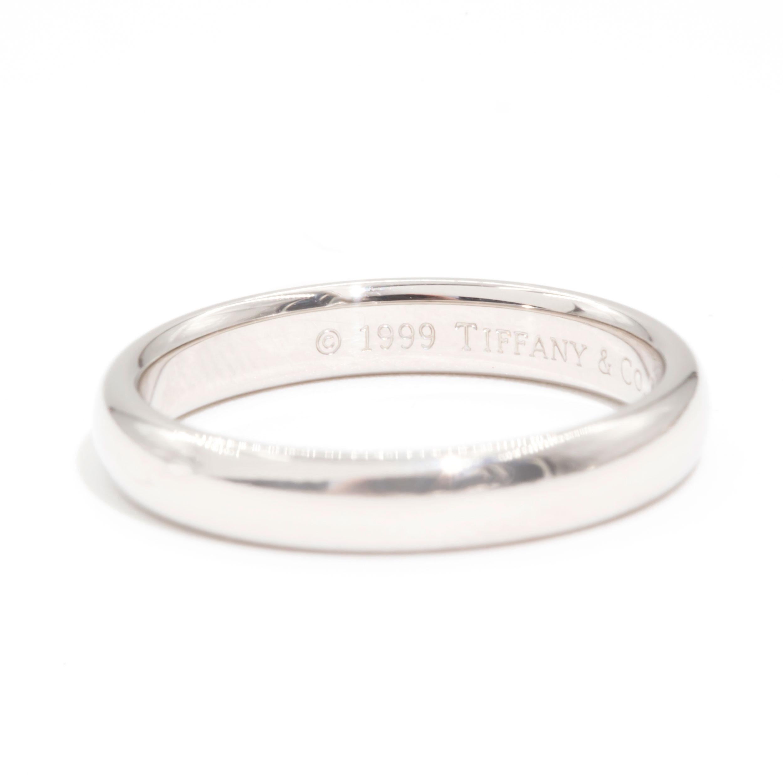 Crafted in Platinum is this genuine Tiffany & Co Tiffany Classic Wedding Band Ring. The Tiffany & Co Tiffany Classic Wedding Band Ring measures 2 millimetres. A simply well made solid band that will last the test of time.  

Ring Size 
J (UK,