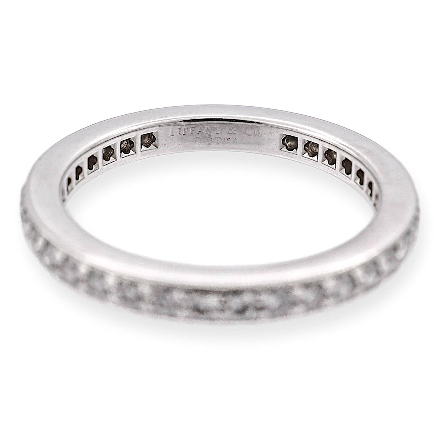 Tiffany & Co. Together Eternity Band, a true testament to timeless elegance and impeccable craftsmanship. This captivating piece features a full circle of round brilliant cut diamonds, meticulously bead set within a mil-grain edge channel, resulting