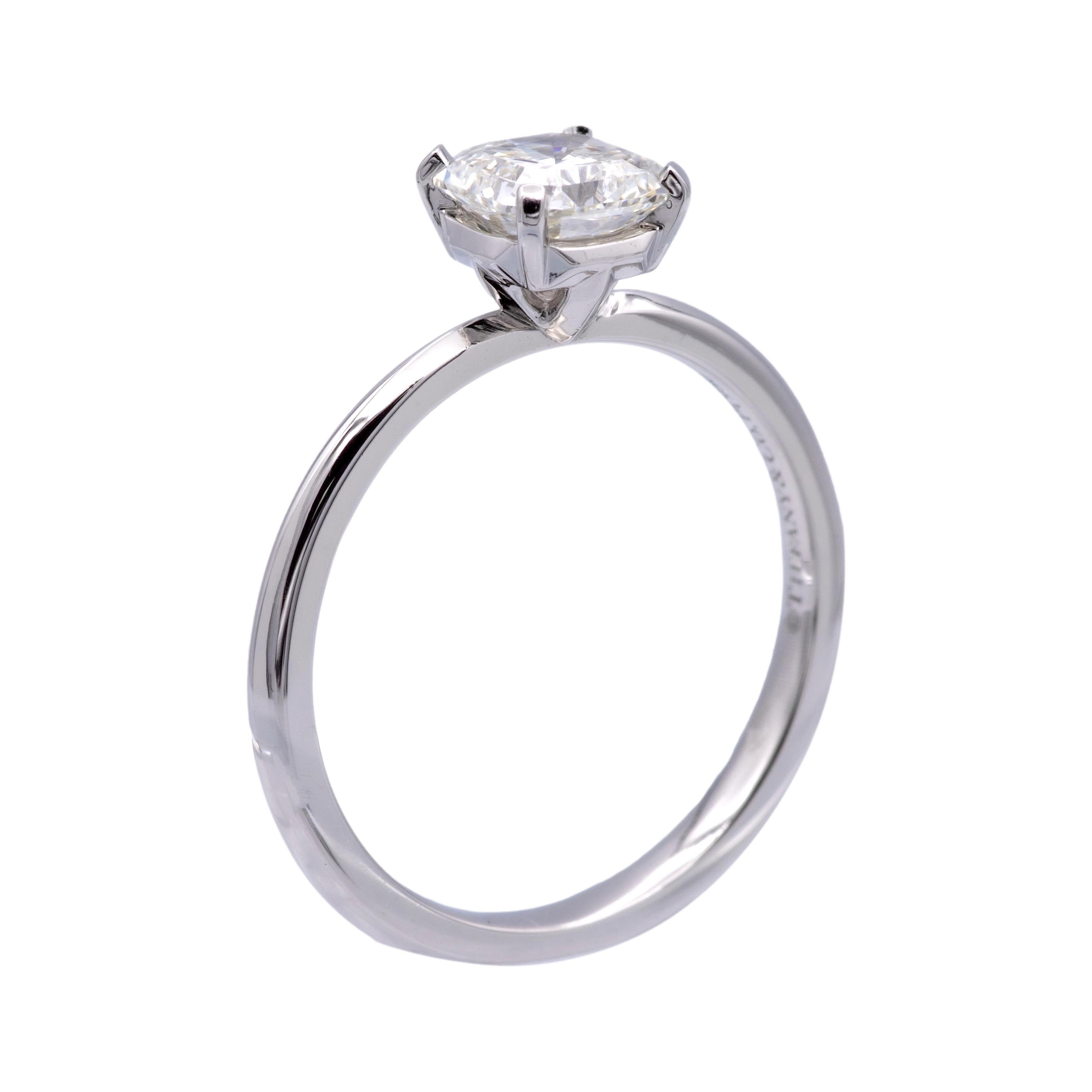 Tiffany & Co. Solitaire Engagement Ring from the True collection finely crafted in platinum featuring Tiffany's signature True cut diamond center weighing .78 carats, I color, VS2 clarity with excellent cut , polish and symmetry set in a 4 prong