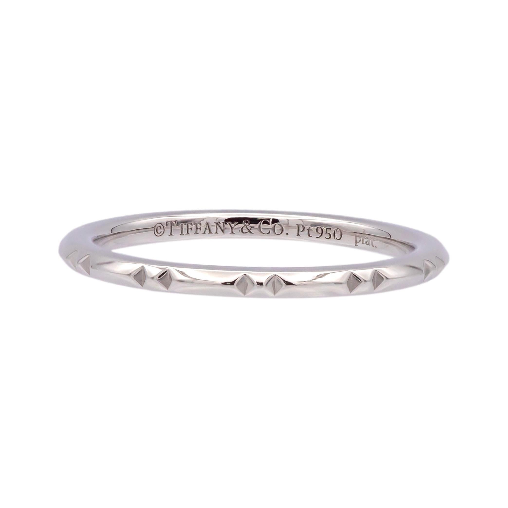 This Tiffany & Co. Platinum True® Wedding Band Ring is crafted in Pt950 platinum with a sleek, modern True Cut design. The 1.5mm width gives it a minimalist yet refined look, perfect for wearing alone or stacked with other rings. Designed for
