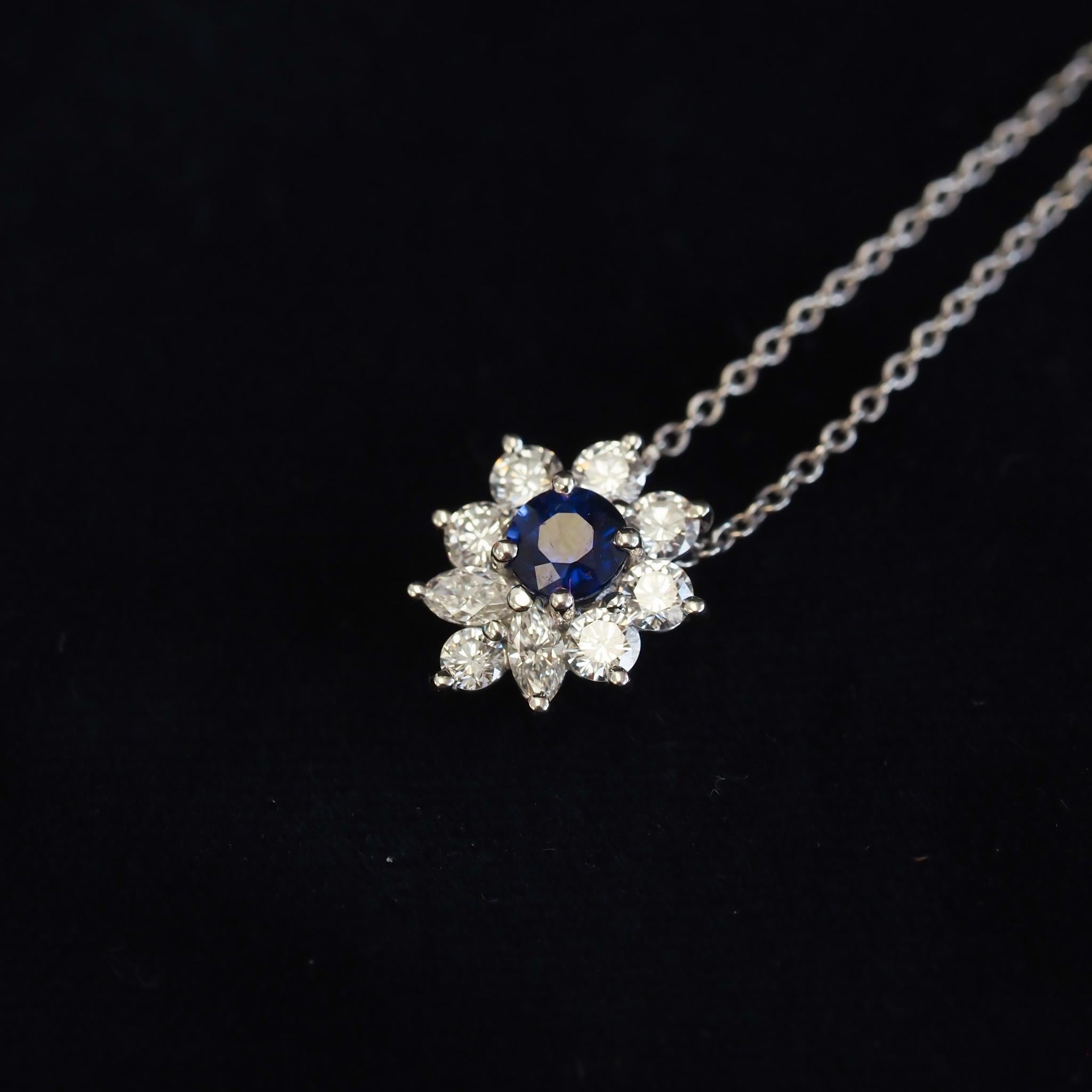 Finely detailed pre owned Tiffany & Co Victoria necklace, crafted in 950 platinum.
9 round brilliant and marquise cut diamonds total an estimated 0.53 carats (estimated at F-G color and VVS clarity).
The round cut sapphire measures 4mm and is