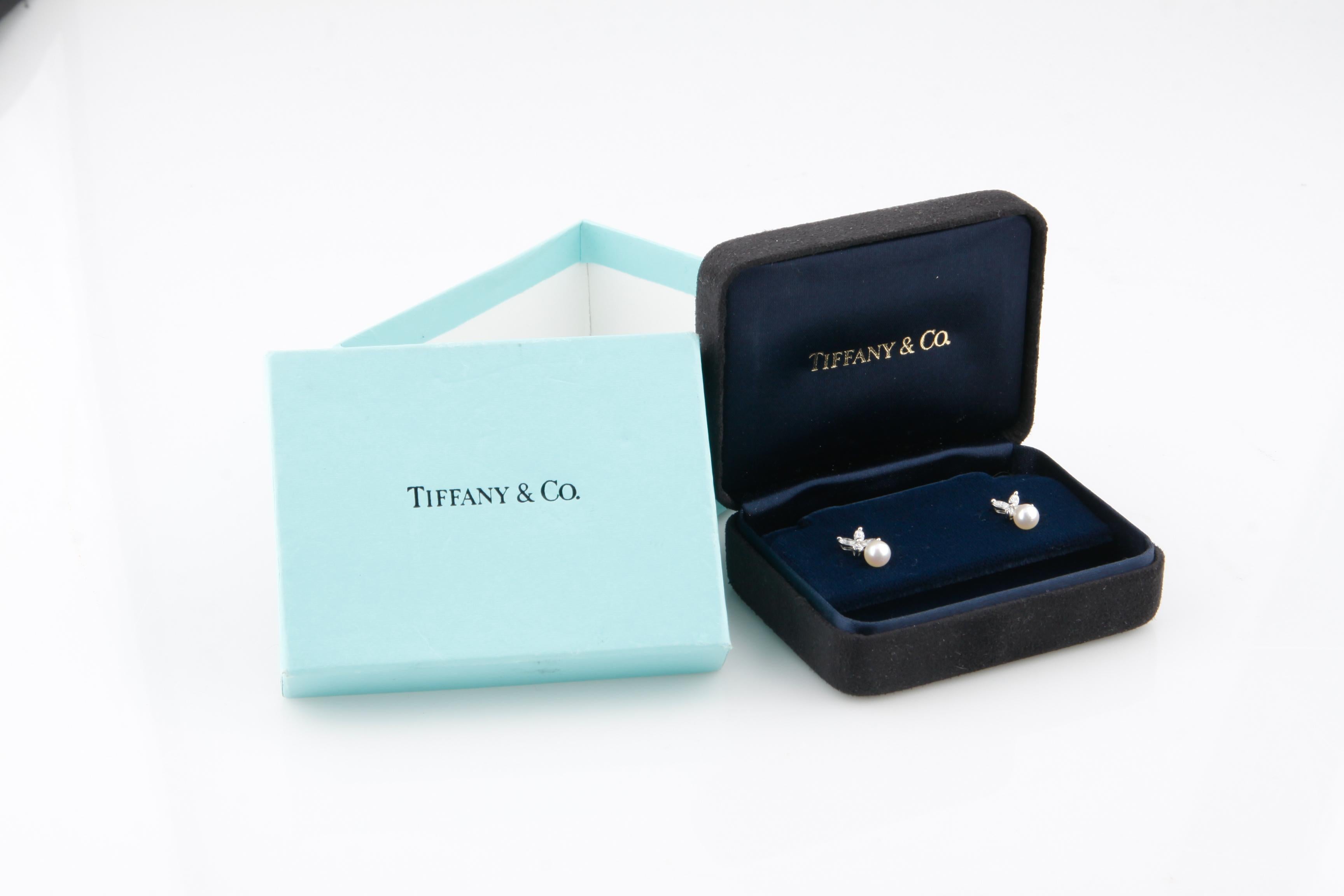 Gorgeous Tiffany & Co. Stud Earrings
Part of the Victoria Collection
Feature 8 Marquise Diamonds in Starburst Configuration
Total Carat Weight = Approximately 0.64 ct
Feature 2 5 mm Pearls
Total Mass = 2.3 grams
Include Original Box and Case
