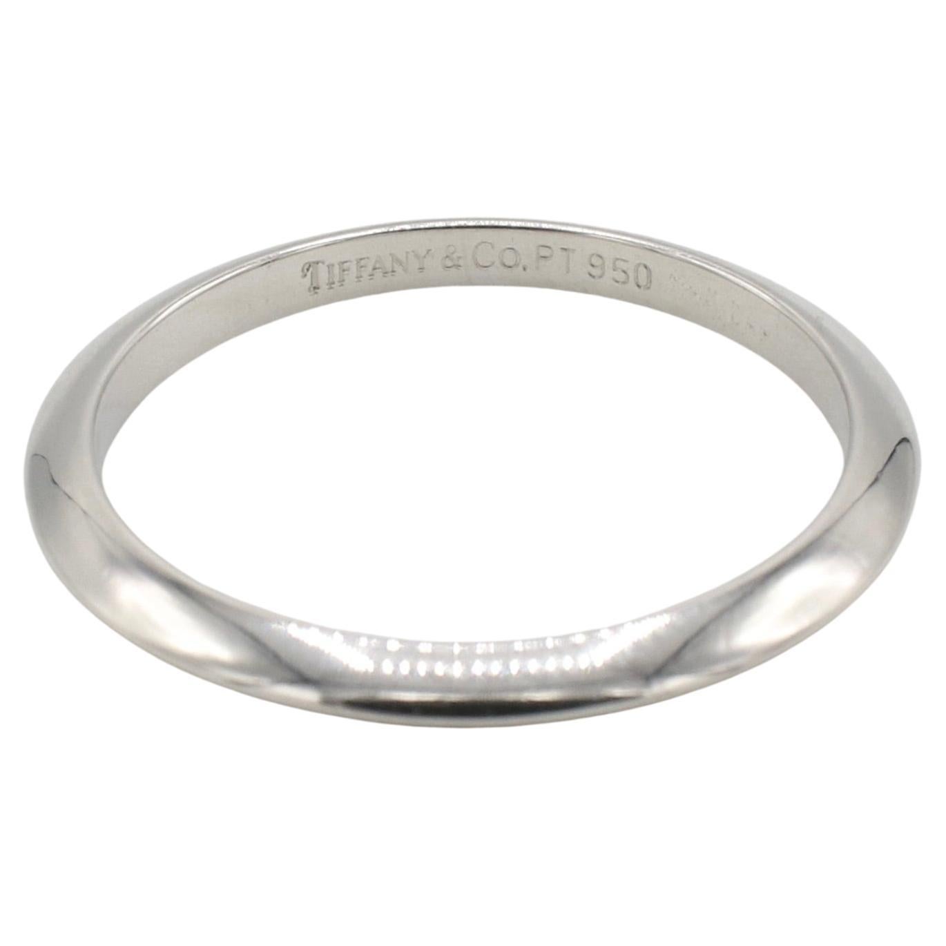 Tiffany & Co. Platinum Wedding Band Ring 
Weight: 2.40 grams
Width: 2mm
Signed: Tiffany & Co. 950
Size: 5.5 (US)
