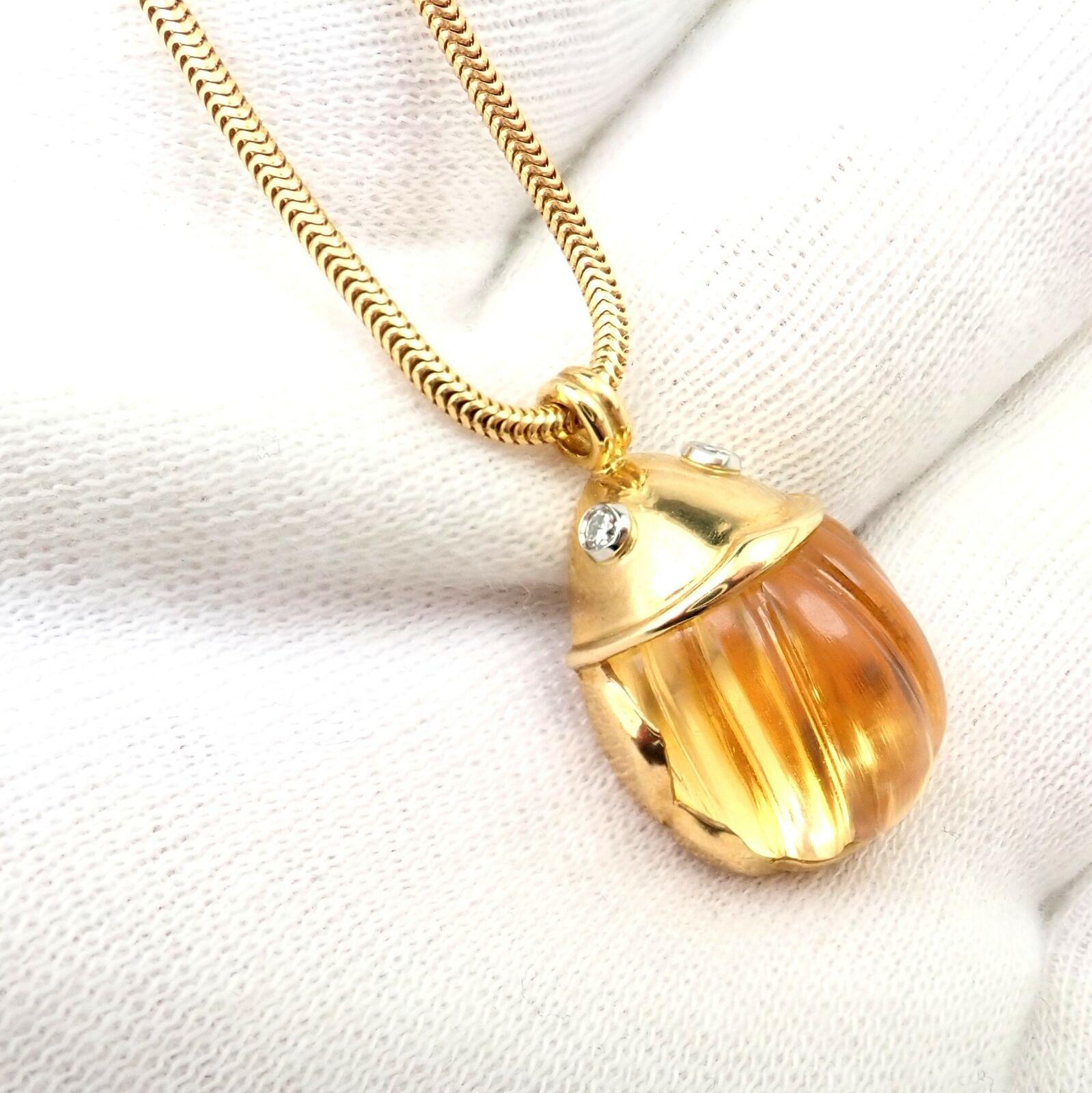 18k yellow gold Carved Citrine Diamond Scarab Pendant Necklace by Tiffany & Co.
With Carved Citrine Scarab 13.5mm x 14mm and 2 G/VS2 Diamonds total 0.05ctw
Details: 
Pendant: 16.5mm x 17mm
Weight: 17.6 grams
Chain Length: 16.5