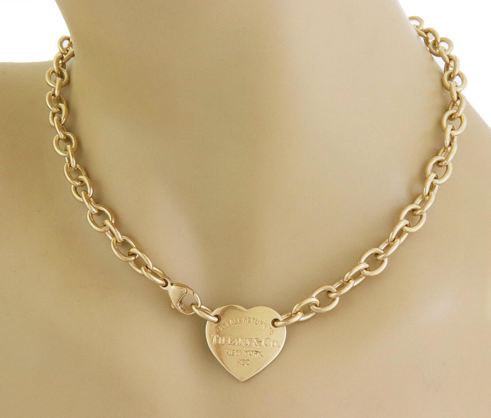 This is a popular authentic necklace from Tiffany & Co. Crafted from 18k yellow gold with a heart shape pendant tag stamped 