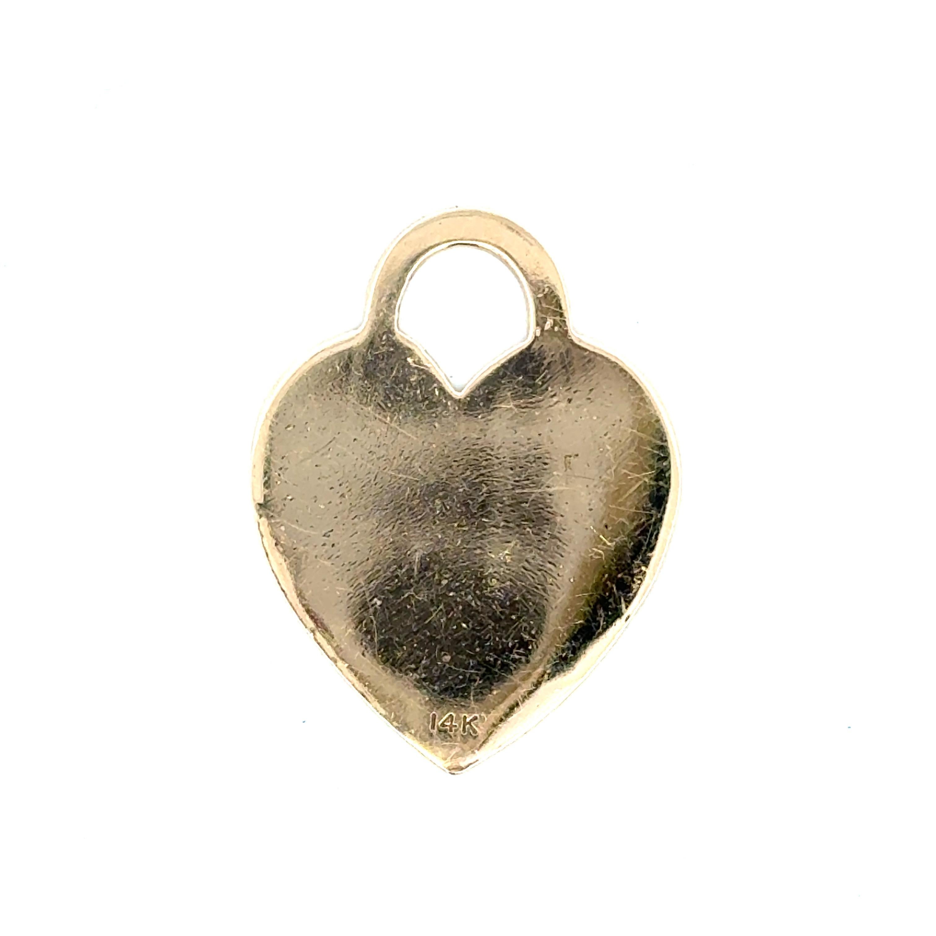 Tiffany & Co, pendentif en or jaune 14 carats gravé Please RETURN TO TIFFANY 
& CO. NEW YORK 007686, 3,2 grammes.