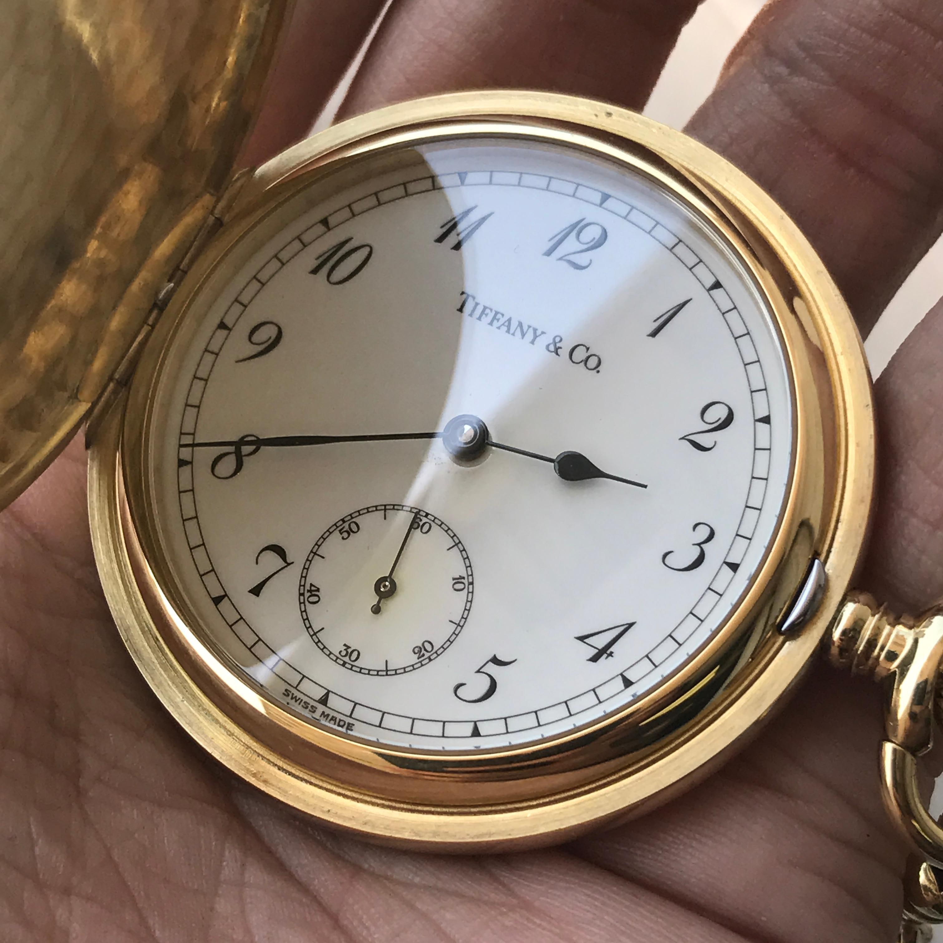 Pocket Watch Details:
Retail Price: Over $15,000.00 Replacement Cost From Tiffany
Metal: Solid 18k Yellow Gold
Size: 48mm Case 
Condition: Mint Condition
Comes With: Tiffany Box, Tiffany Gift Receipt, Pocket Watch and Tiffany Gold Chain shown in