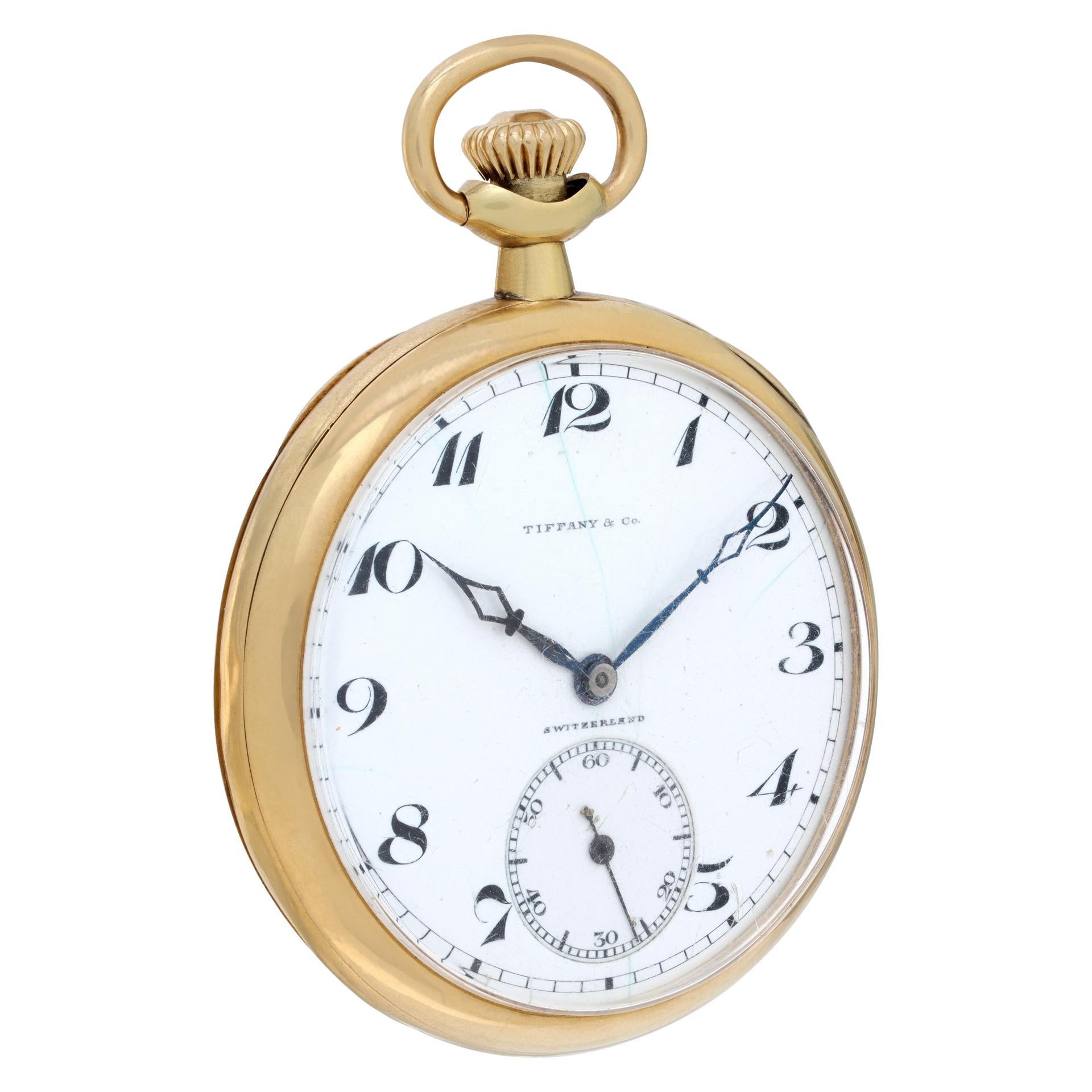 Tiffany & Co. pocket watch in 18k yellow gold smooth high polish finish. Hairline crack on the porcelain dial. 44mm case size. Manual wind movement made by Agassiz, 17 jewels. Double back dust cover. Some dents on the outside 18k cover. Fine