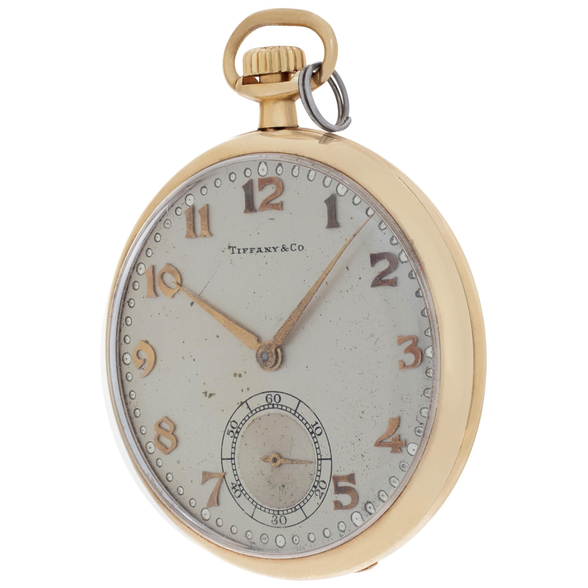 Hamilton retailed by Tiffany & Co. in 14k yellow gold. Made in the USA.  Manual w/ subseconds. Crica 1920. Fine Pre-owned Tiffany & Co. Watch. Certified preowned Vintage Tiffany & Co. pocket watch watch is made out of yellow gold. This Tiffany & Co.