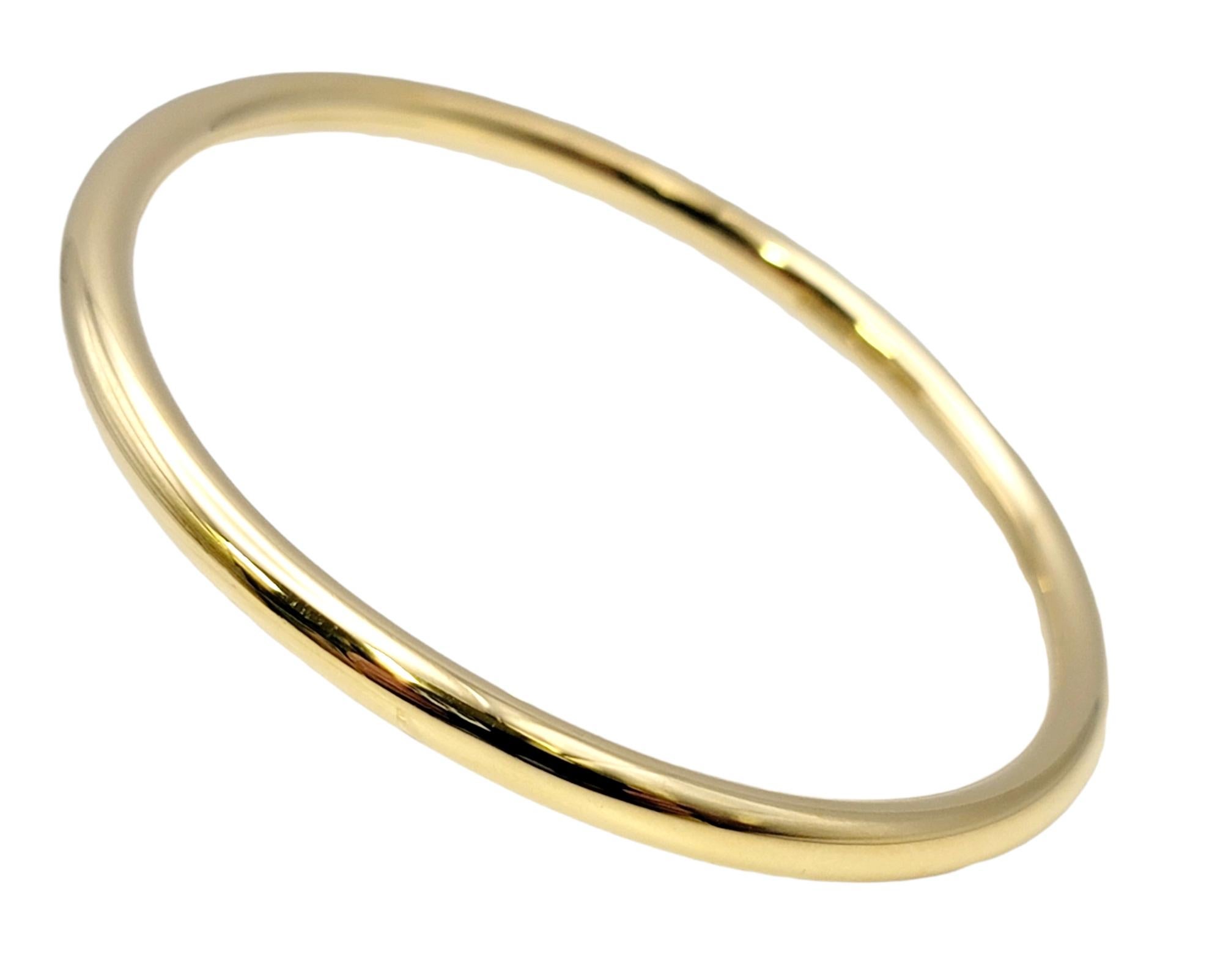Chic modern bangle bracelet by Tiffany & Co.. This piece is the perfect everyday bracelet and goes with just about everything. Dress it up or down, pair it with other bracelets for a trendy, layered look, or simply wear it on its own for a simple,