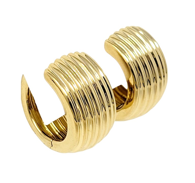 Chic, modern yellow gold hoop earrings are an absolute must for your jewelry wardrobe! Dress them up or down, take them from the office to date night, these timeless earrings are the perfect pair.

Earring style: Hoop
Metal: 18K Yellow Gold
Weight: