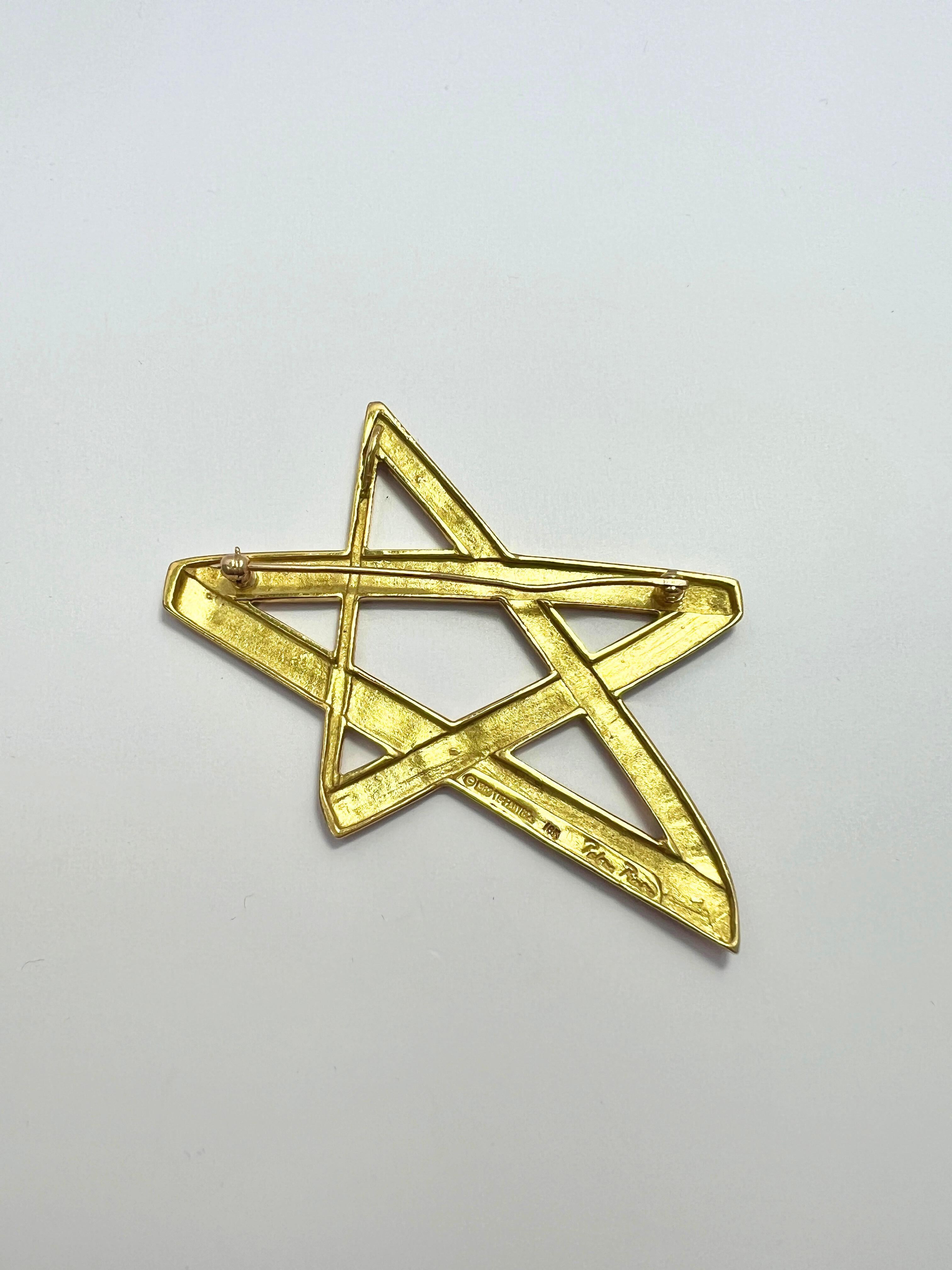 Tiffany & Co Poloma Picasso Broche estrella vintage de oro de 18 quilates

Se puede llevar como broche o como collar con un pequeño gancho en la parte posterior. 

Medidas: 2.4
