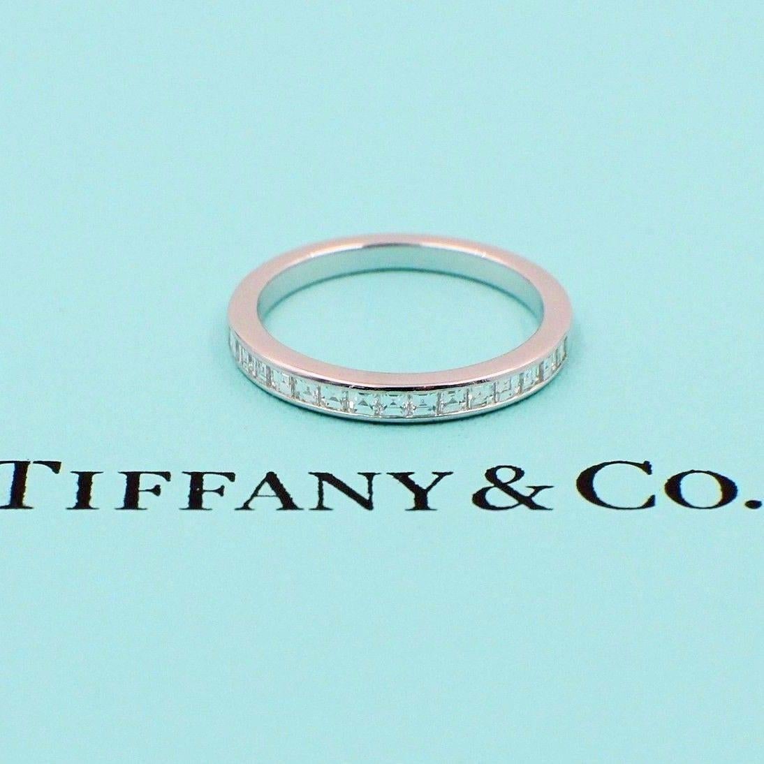 Tiffany & Co.
Style:  Princess cut Diamond Half Circle Band
Sku:  22613162
Metal:  Platinum PT950
Size:  5.5
Width:  2.6 MM
Total Carat Weight:  0.39 TCW
Diamond Shape:  Round Brilliant Diamonds 0.39 TCW
Diamond Color & Clarity:  F - G /