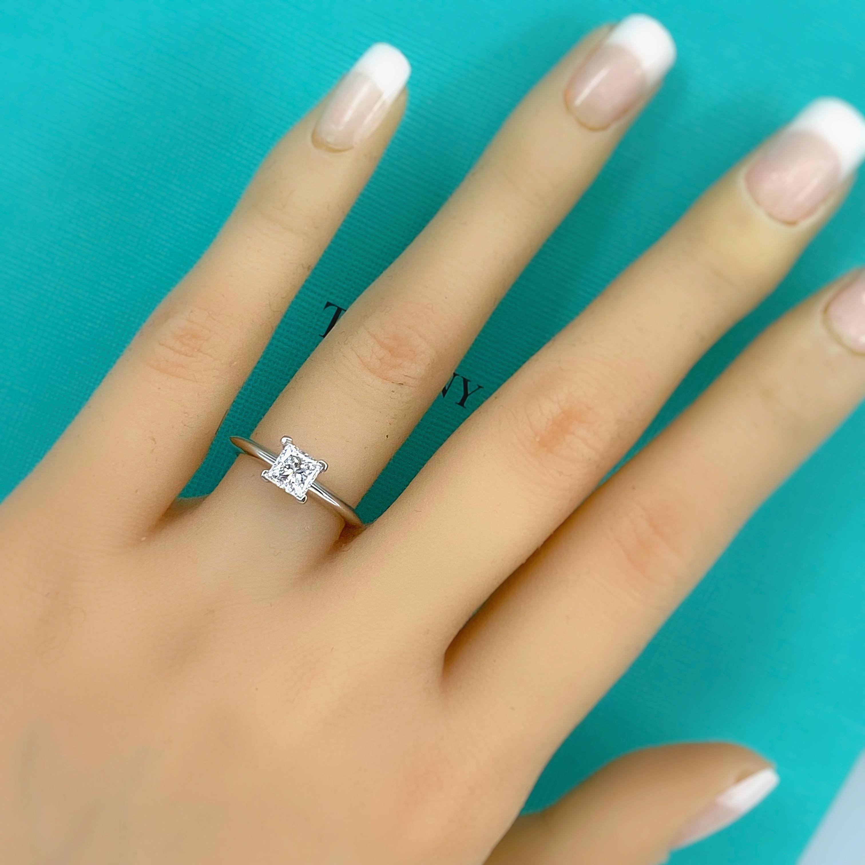 Tiffany & Co. Classic Princess Cut Diamond Solitaire Engagement Ring
Style:  Solitaire 4-Prong
Diamond Registration #:  22956515/I04190390
Metal:  Platinum PT950
Size:  6 sizable 
TCW:  0.73 cts
Main Diamond:  Princess Cut Diamonds 0.73 cts 
Color &