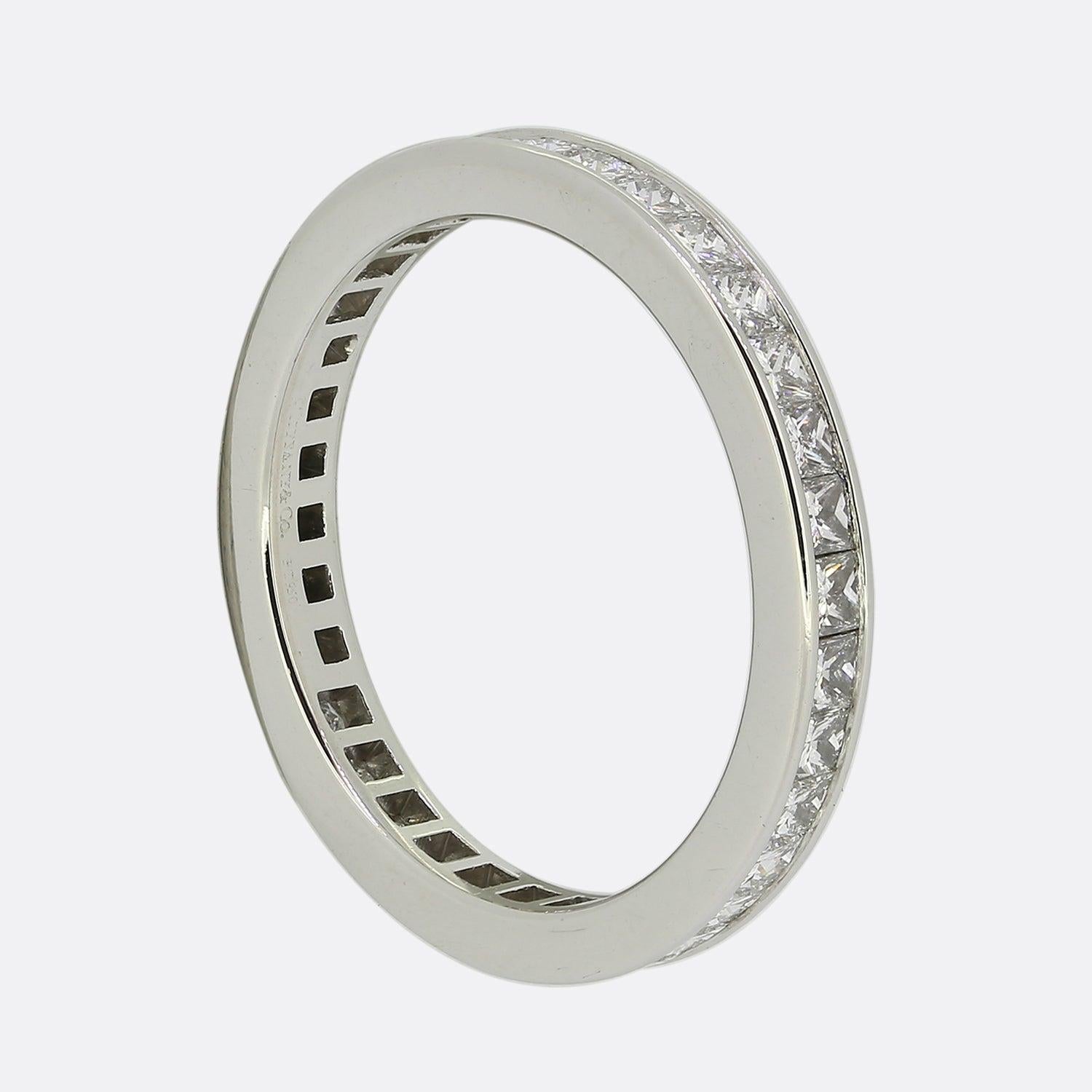 Here we have a classic full eternity diamond ring from the world renowned jewellery designer, Tiffany & Co. This platinum ring has been expertly set with a full circle of 34 perfectly matched princess cut diamonds in a channelled setting.
It is as