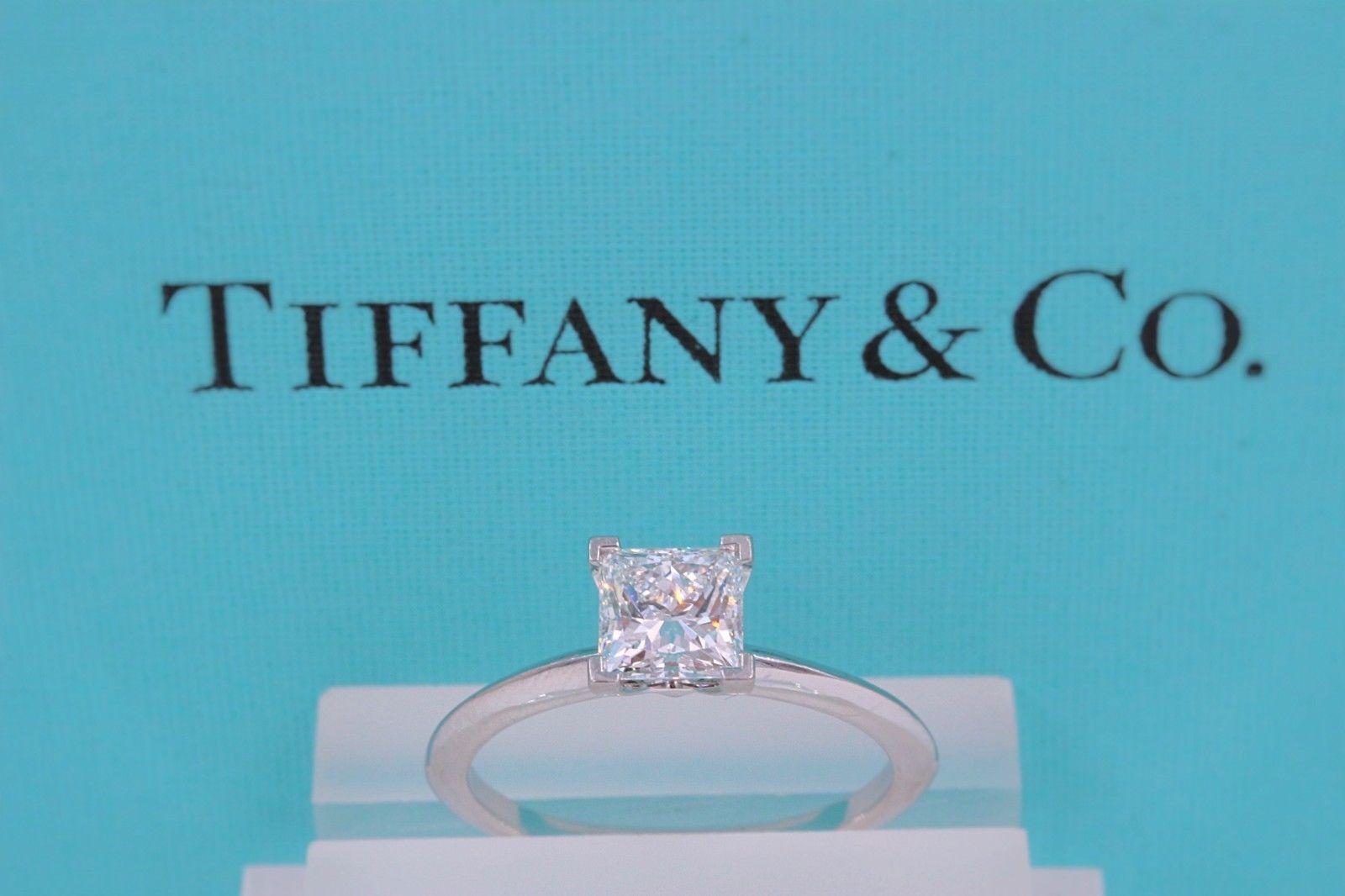 Tiffany & Co.
Style:  Solitaire
Serial Number:  T&C Diamond Certificate 6278701/S11220083
Metal:  Platinum PT950
Size:  6 - sizable
Total Carat Weight:  1.20 cts
Diamond Shape:  Princess / Square Modified Brilliant 1.20 cts
Diamond Color & Clarity: 