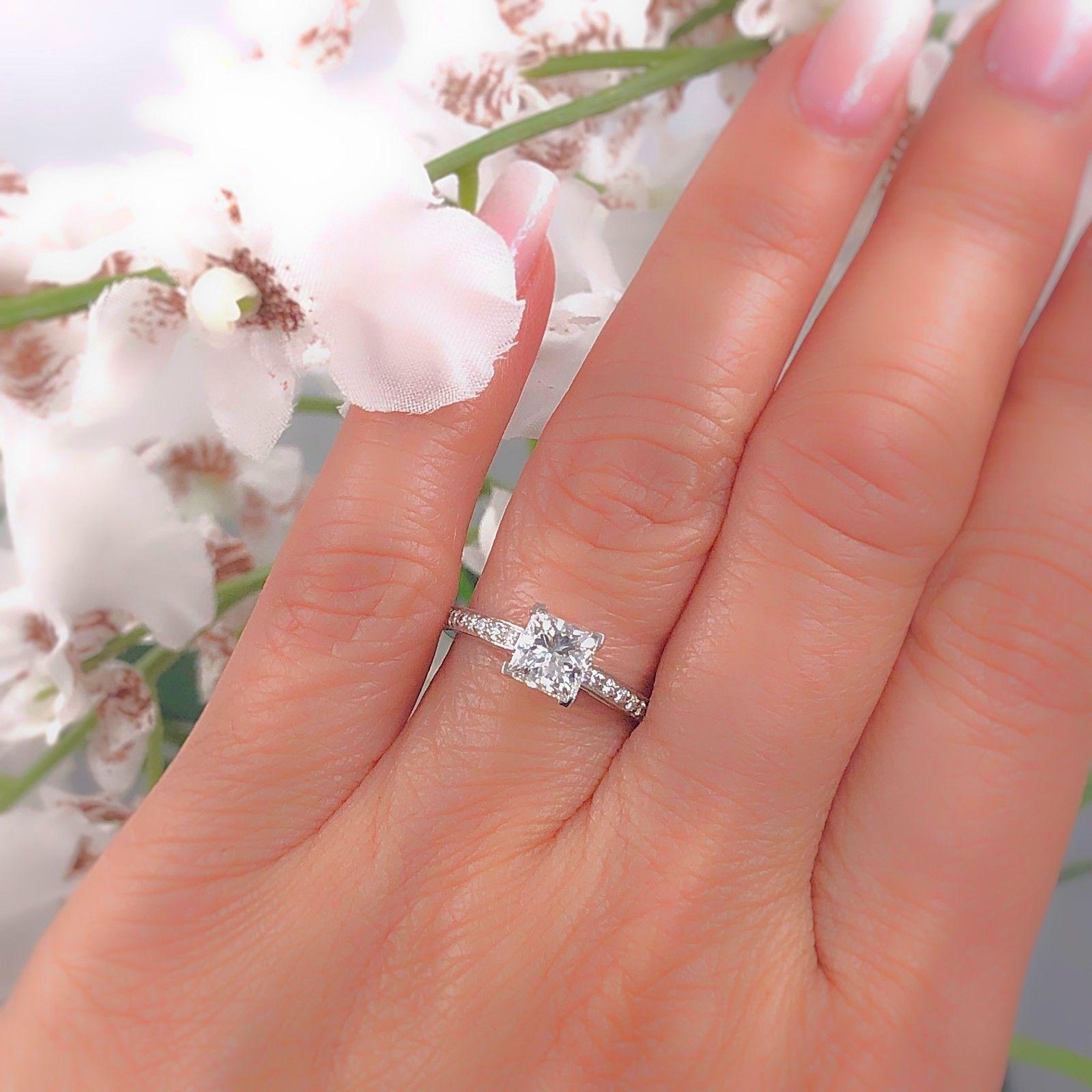 Tiffany & Co. Diamond Engagement Ring
Style:  Tiffany Grace
Serial Number:  # 33682646
Metal:  Platinum PT950
Size:  5.75 - Sizable
Total Carat Weight:  1.29 tcw
Diamond Shape:  Center Diamond - Princess Cut 1.09 cts H color, VVS1 clarity
Accent