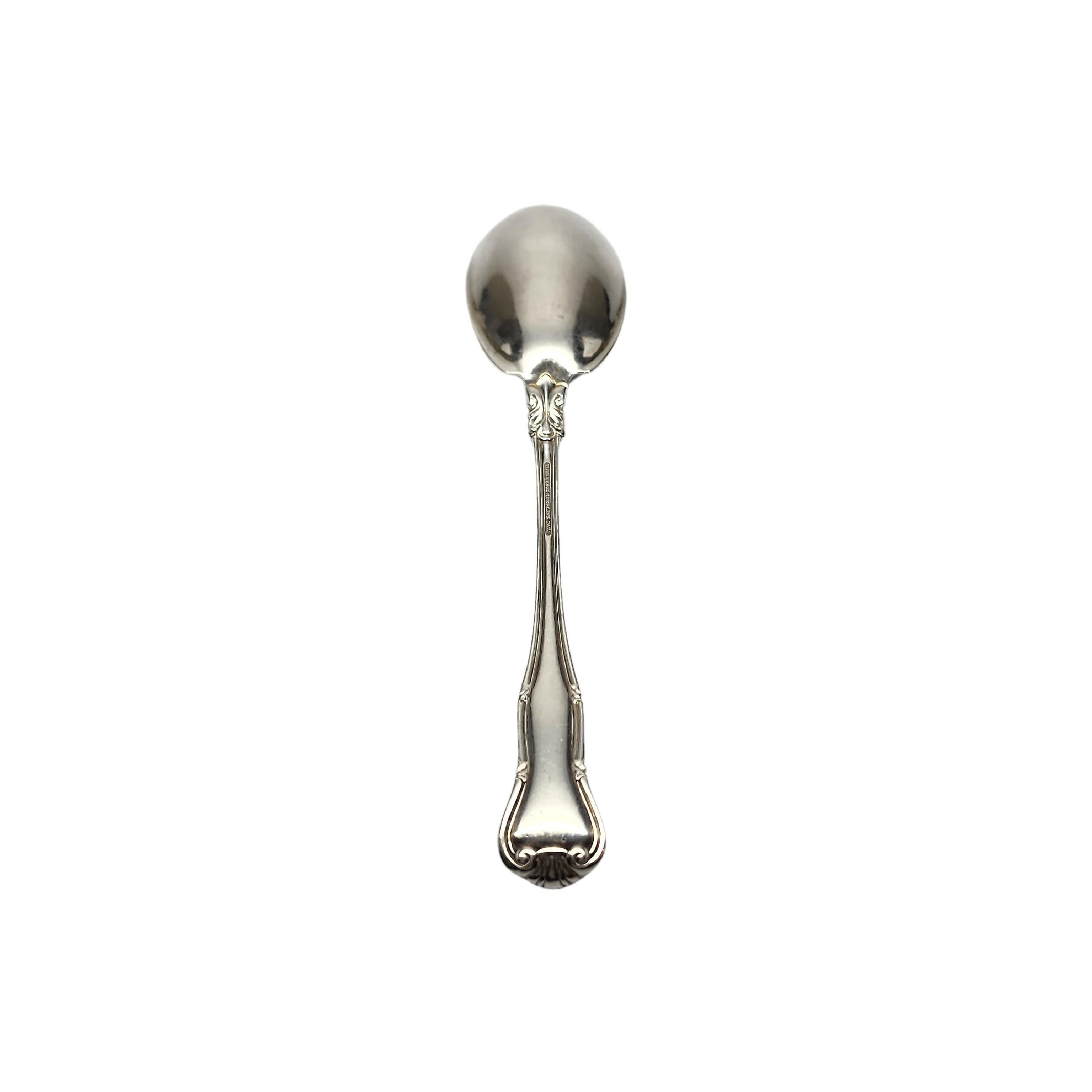 Sterling silver preserve spoon by Tiffany & Co in the Provence pattern with monogram.

Monogram appears to be U

Introduced in 1961, the Provence pattern features a crested arch, inspired by 18th Century French motifs. Hallmarks date this piece to