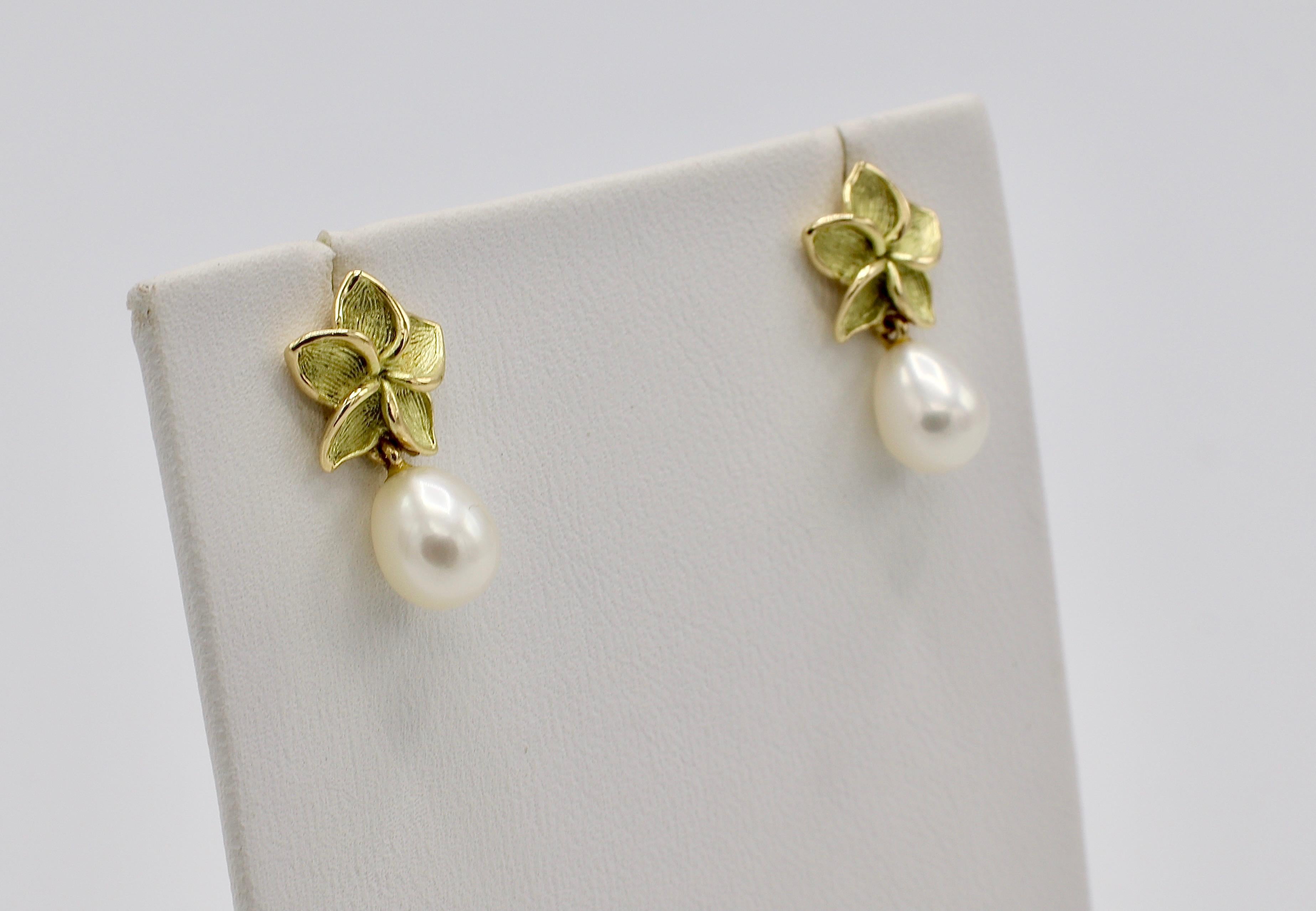 Tiffany & Co. Pulmeria 18 Karat Gold & Freshwater Pearl Flower Drop Earrings 
Metal: 18k yellow gold
Weight: 3.56 grams
Pearls: 6-6.5MM
Length: 18MM
Retail in 2003, $900 