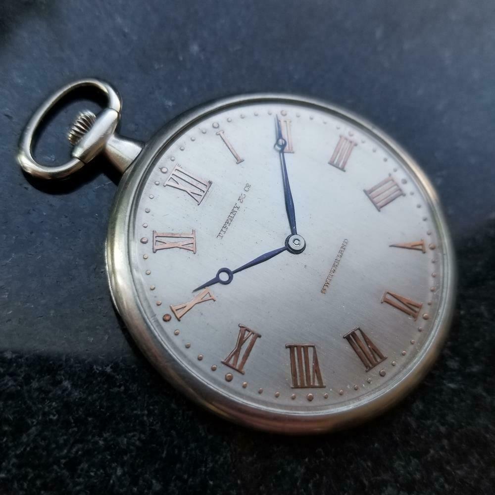 Timeless luxury, solid platinum Art Deco Tiffany & Co. open face pocketwatch, c.1930s. Verified authentic by a master watchmaker. Gorgeous silver Tiffany & Co. signed dial, applied rose gold Roman numeral hour markers, steel blue minute and hour
